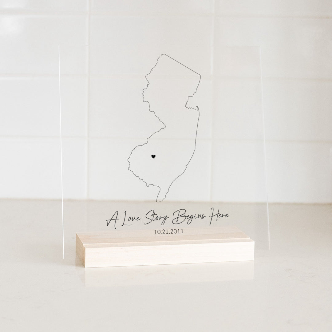 Clear acrylic sign with wood base featuring a New Jersey location and custom text
