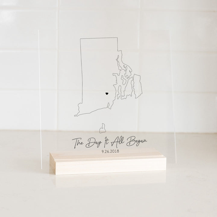 Clear acrylic sign with wood base featuring a Rhode Island location and custom text
