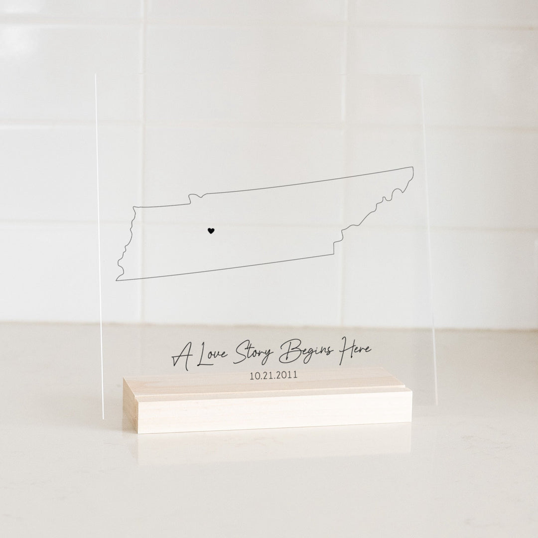 Clear acrylic sign with wood base featuring a Tennessee location and custom text