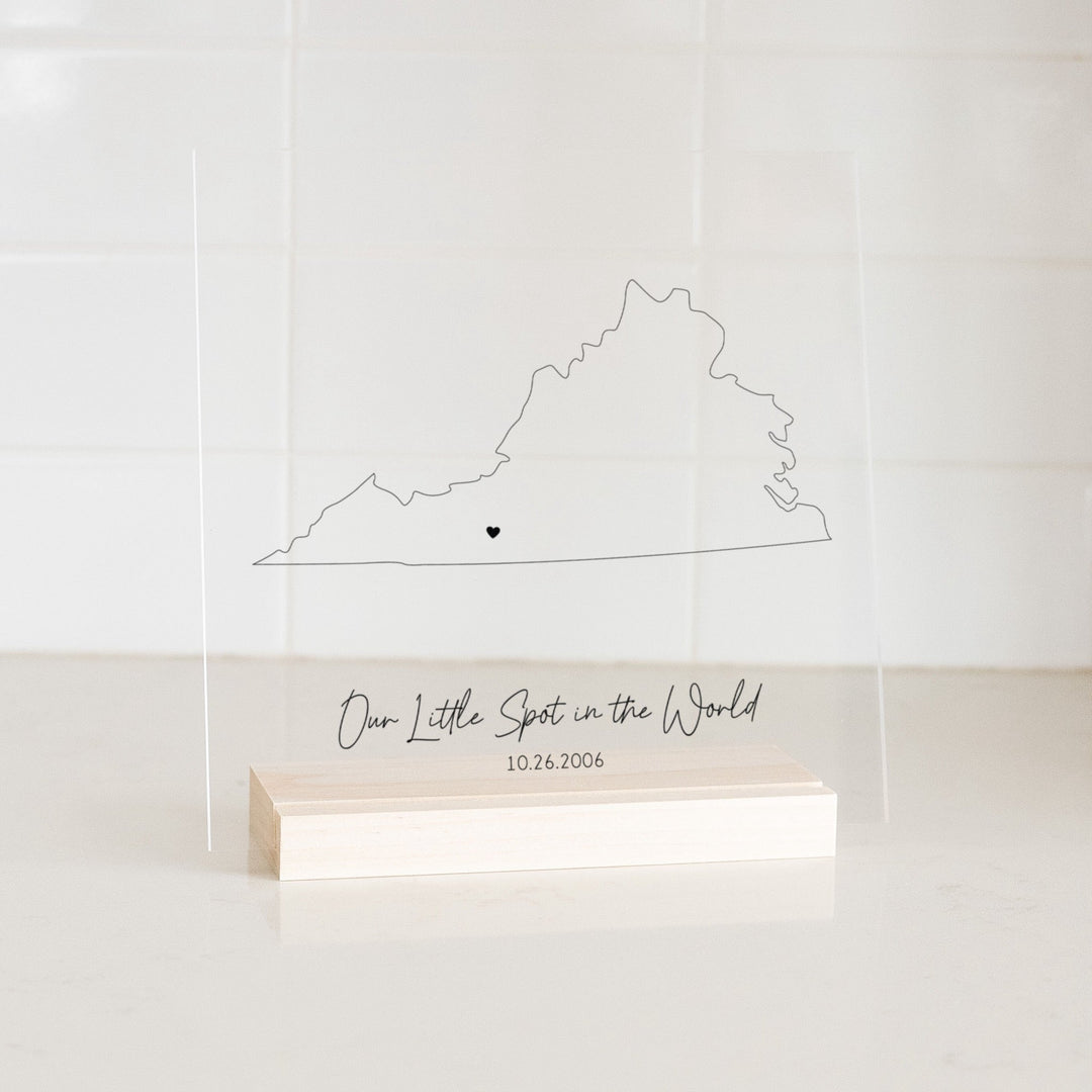 Clear acrylic sign with wood base featuring a Virginia location and custom text