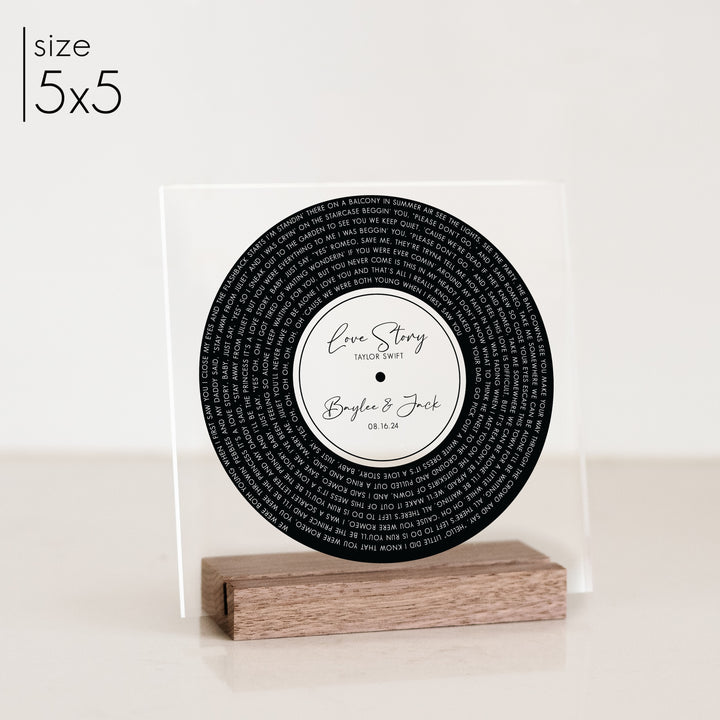 A 5x5 record anniversary gift on a walnut stand.