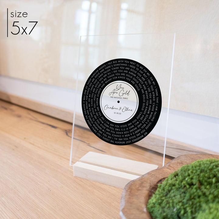 Custom record anniversary gift 5x7 on a blonde stand.