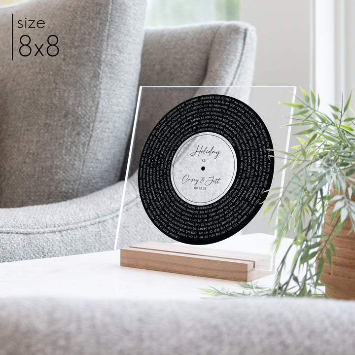 A custom record art with a walnut stand in a living room.