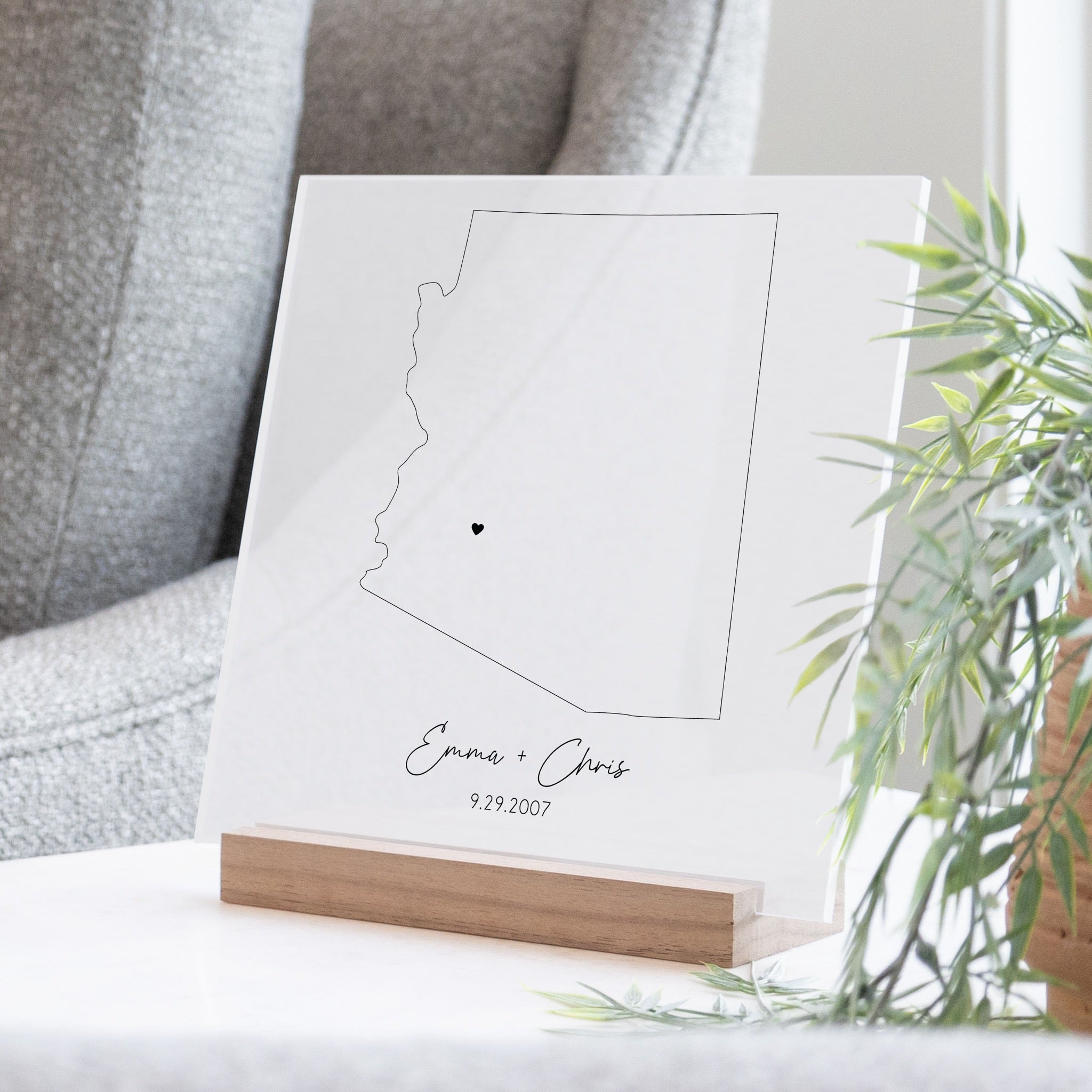 Clear acrylic sign with wood base featuring an Arizona location and custom text
