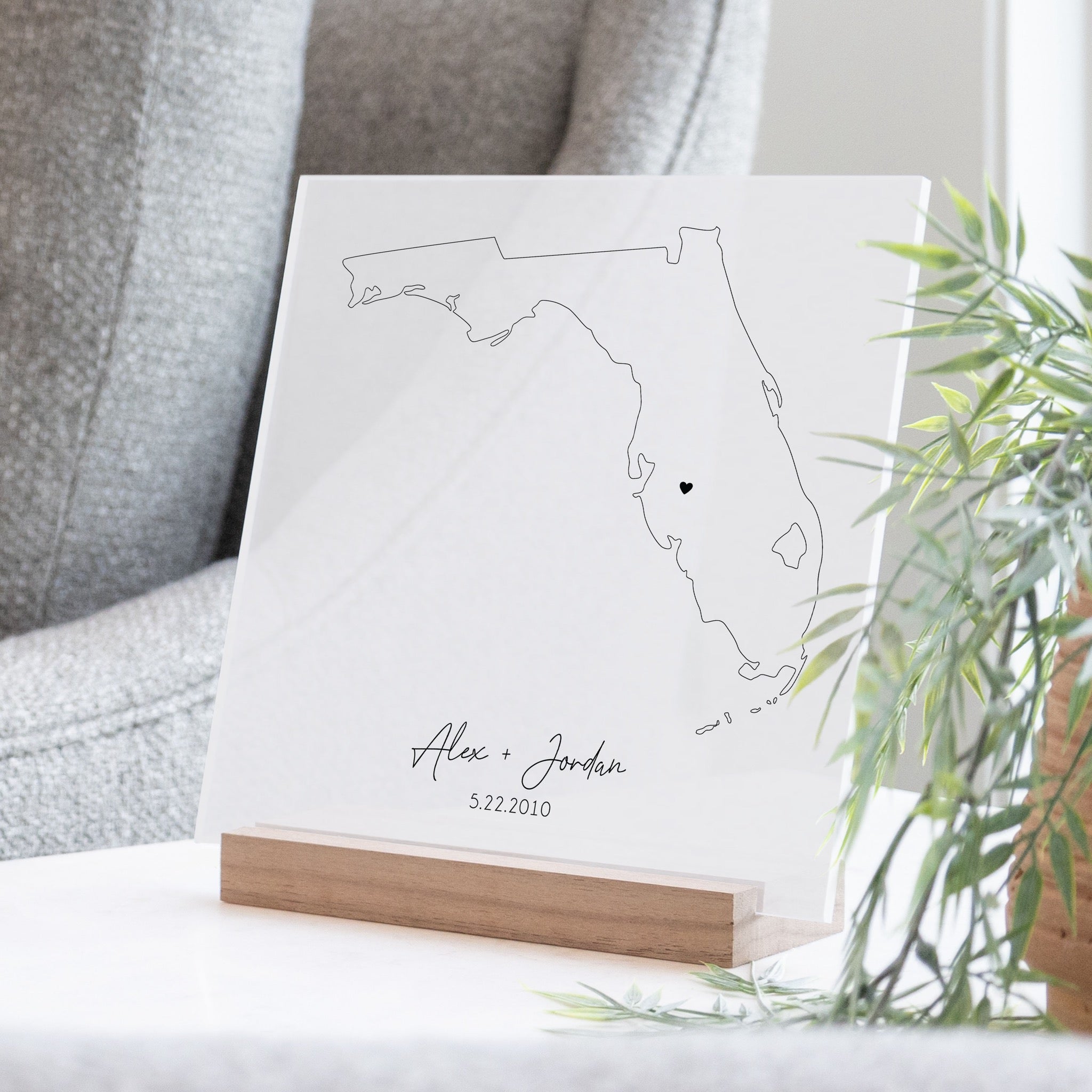 Clear acrylic sign with wood base featuring a Florida location and custom text