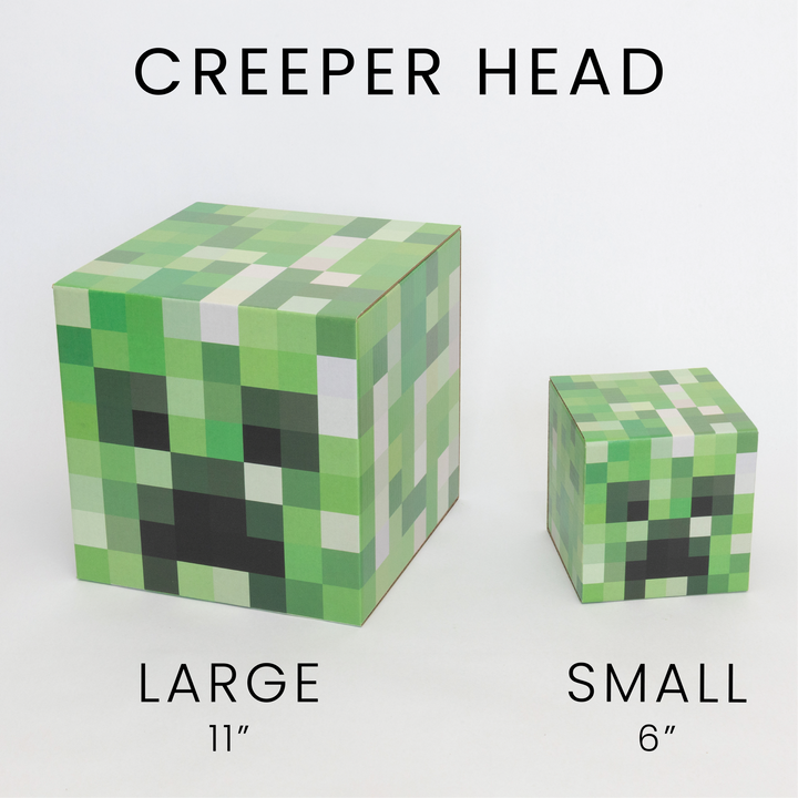 Creeper head large and small cardboard pixel cubes.