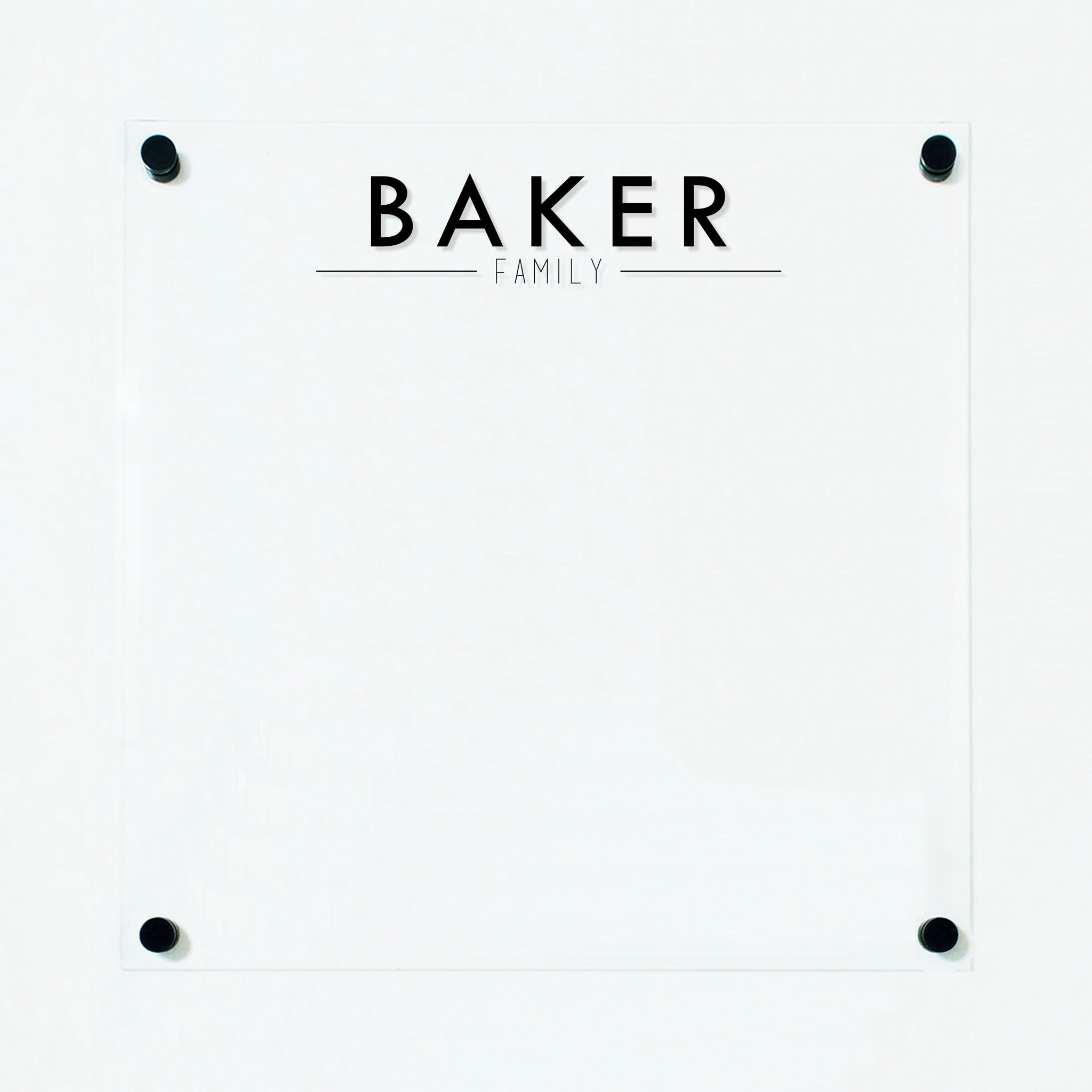 A dry-erase board made of clear acrylic with a custom title up top