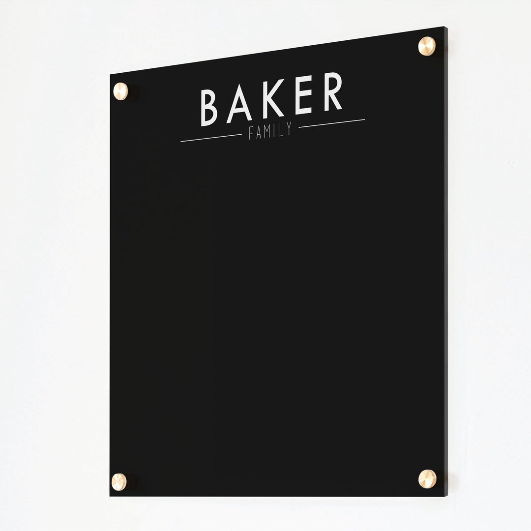 A dry-erase board made of clear acrylic with a custom title up top