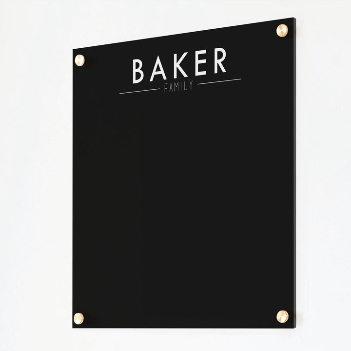 A dry-erase board made of clear acrylic with a custom title up top