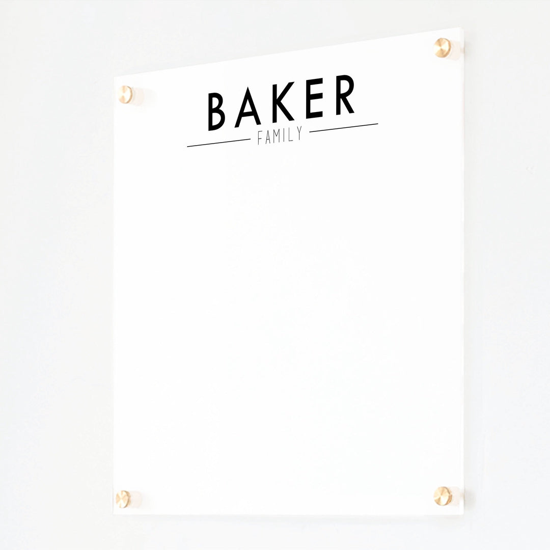 A dry-erase board made of clear acrylic with a custom title up top