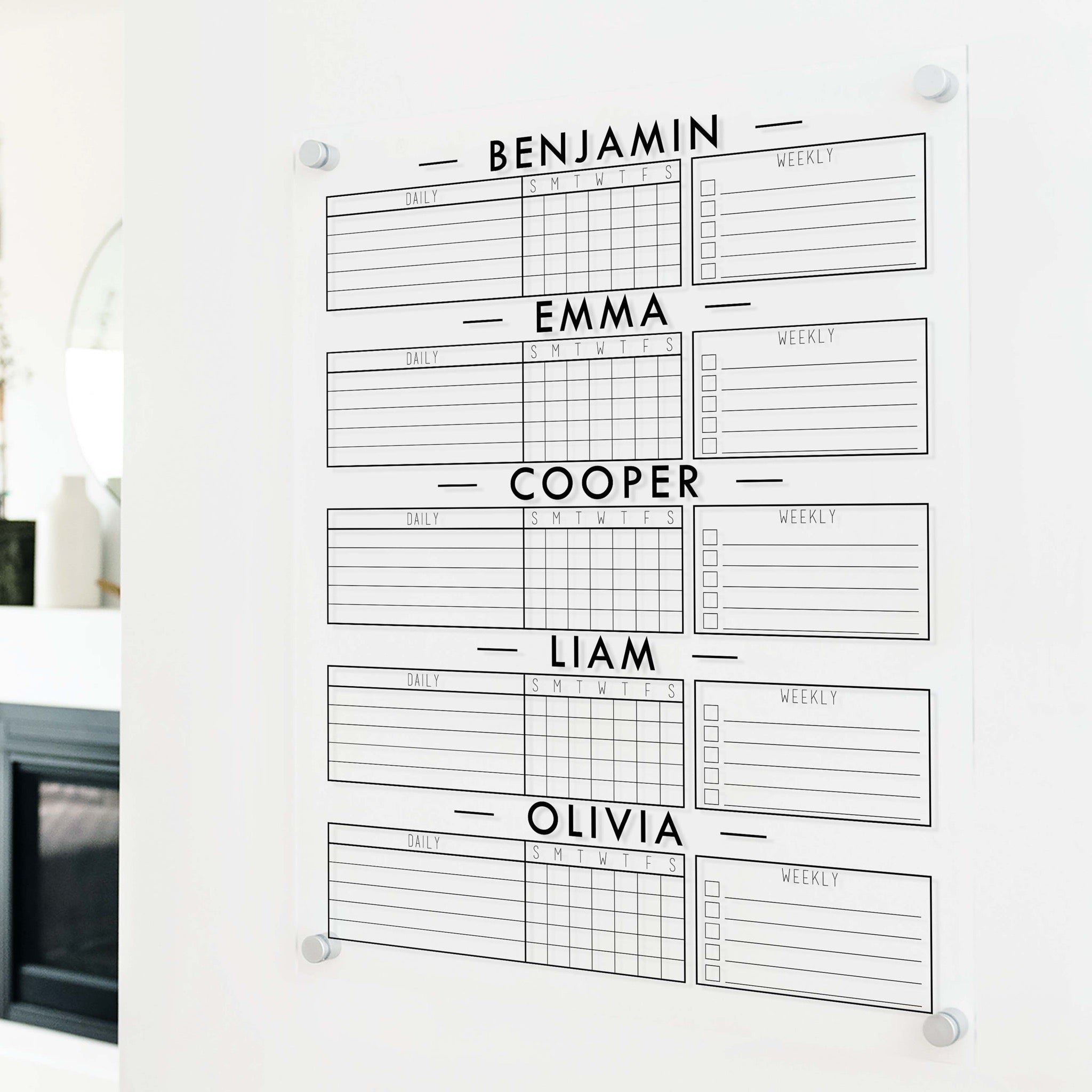 A Dry-erase acrylic chore chart hanging on the wall