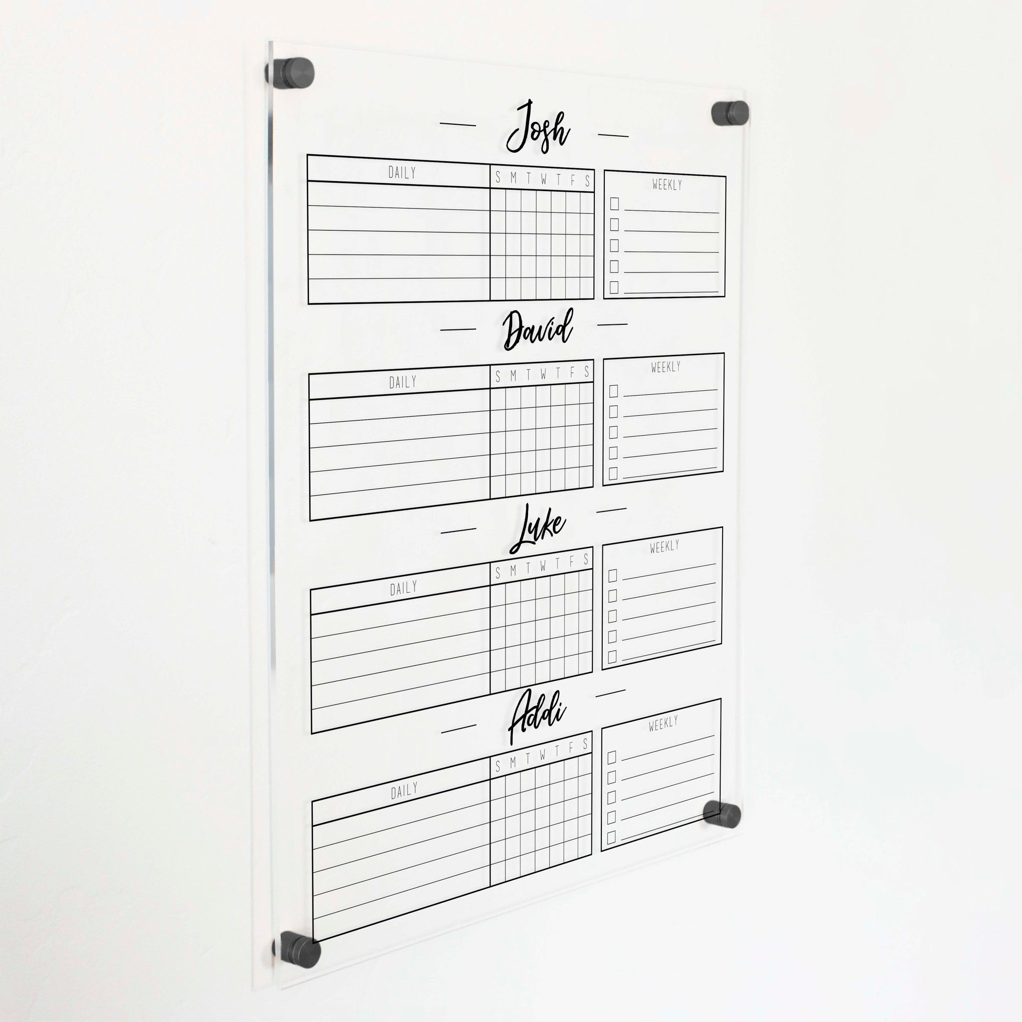 A Dry-erase acrylic chore chart hanging on the wall
