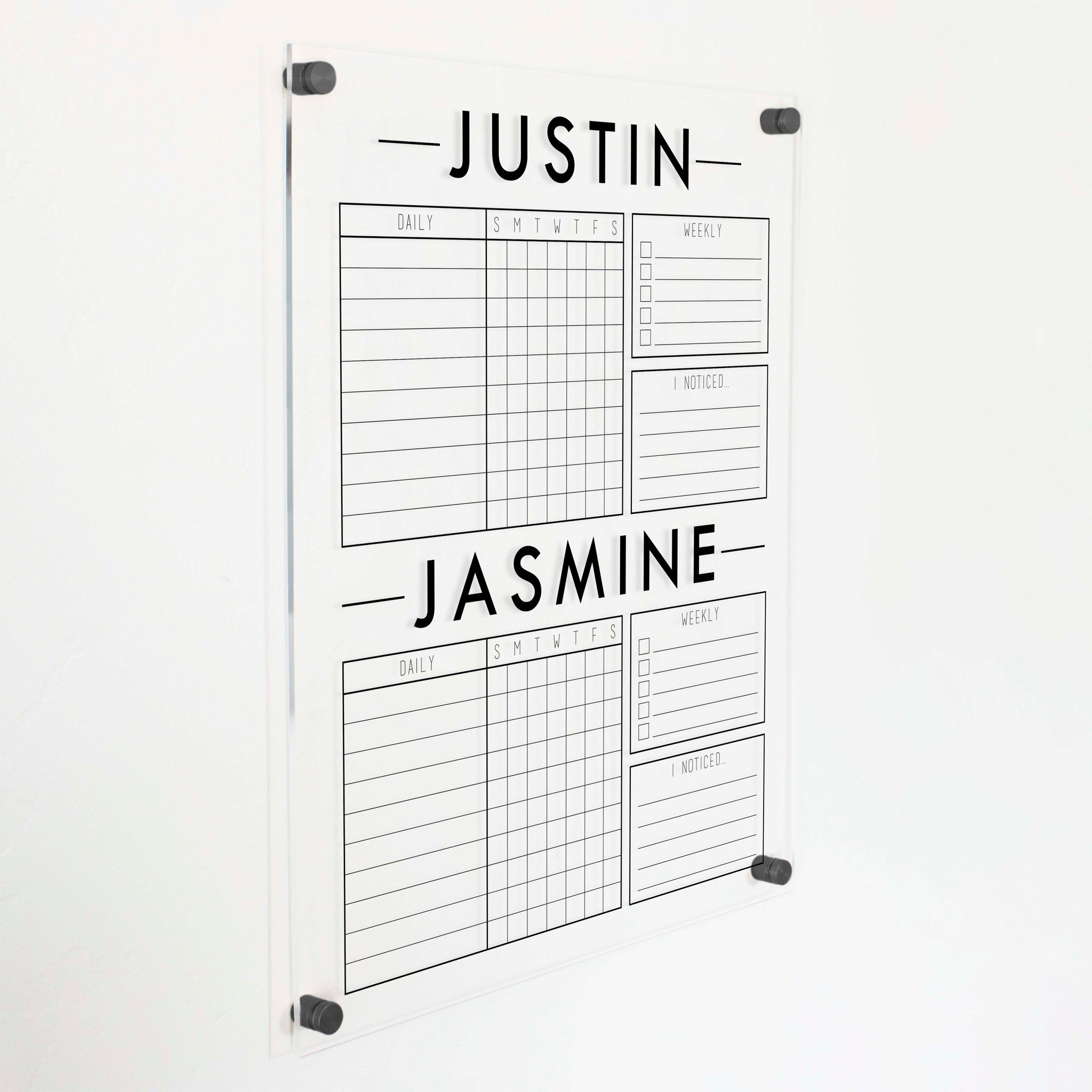 A Dry-erase acrylic chore chart hanging on the wall