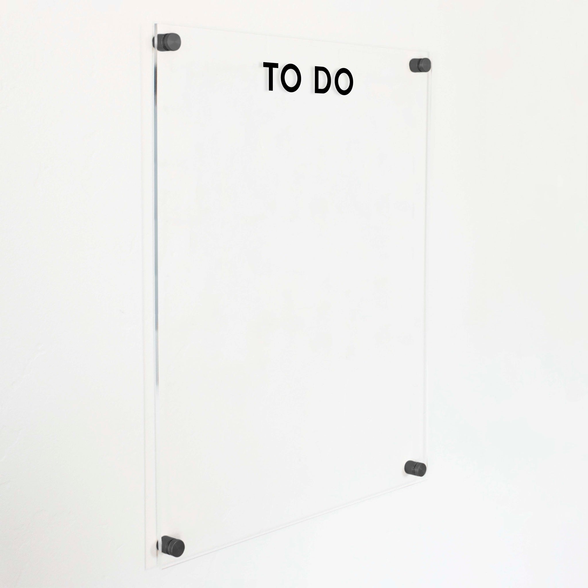 A dry-erase board made of clear acrylic with a custom title up top