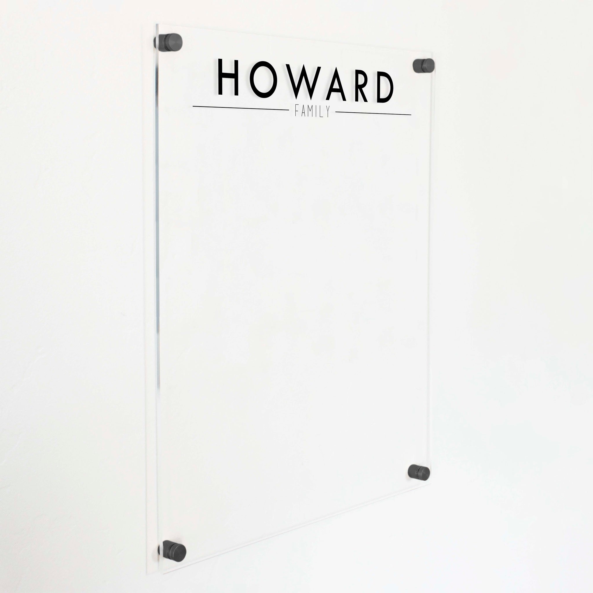 A dry-erase board made of clear acrylic with a custom title up top