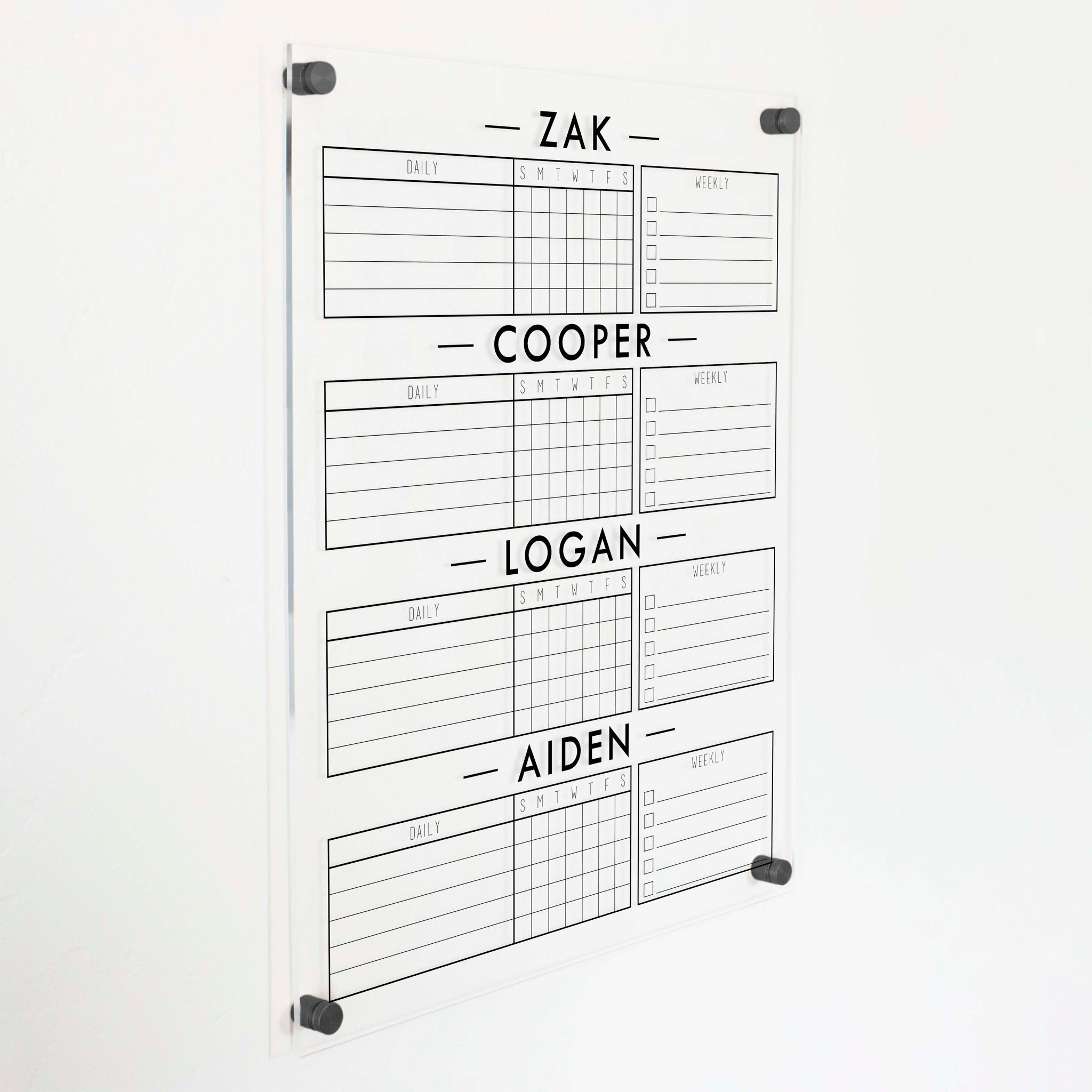 A Dry-erase acrylic chore chart hanging on the wall