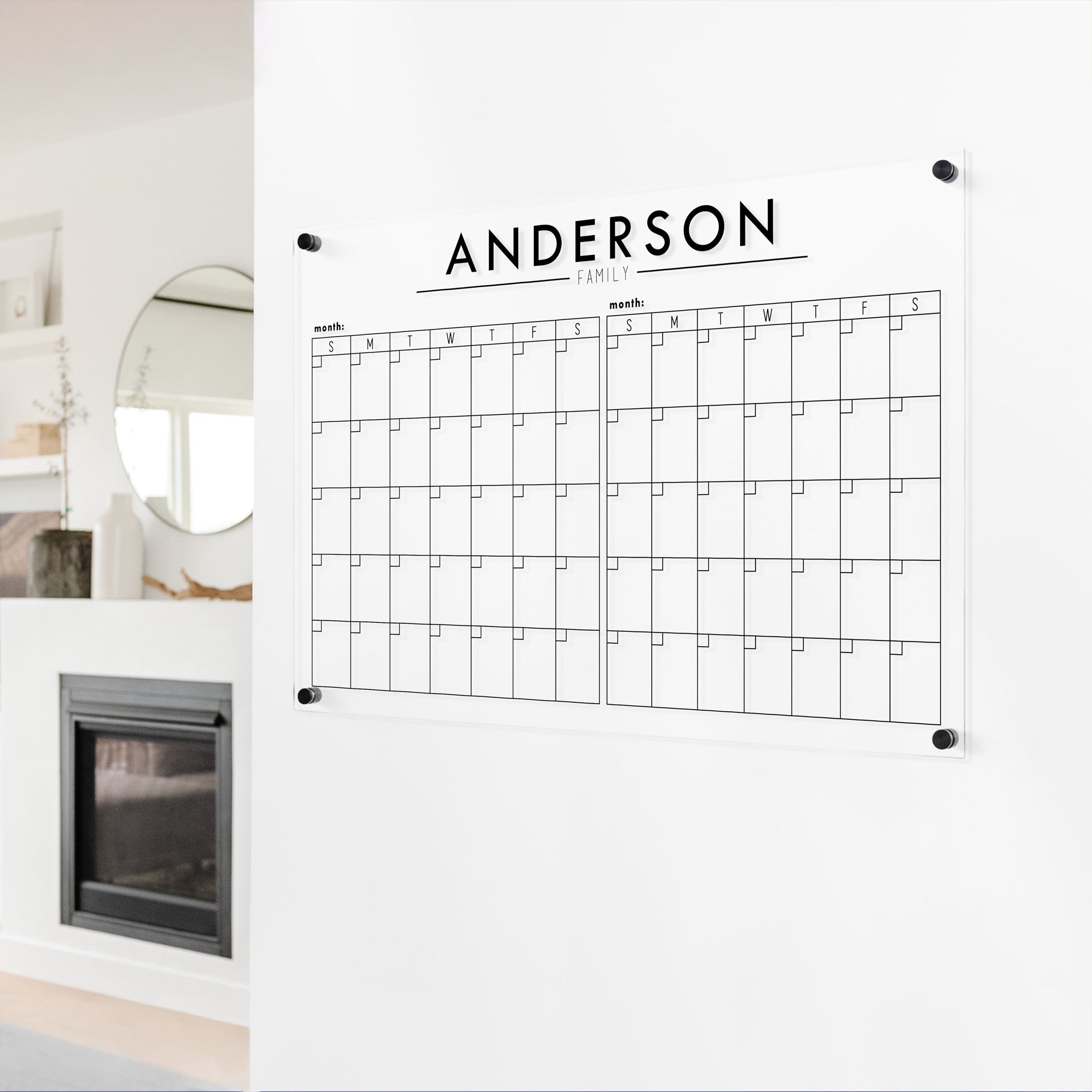A Dry-erase acrylic calendar with a two month design format hanging on the wall
