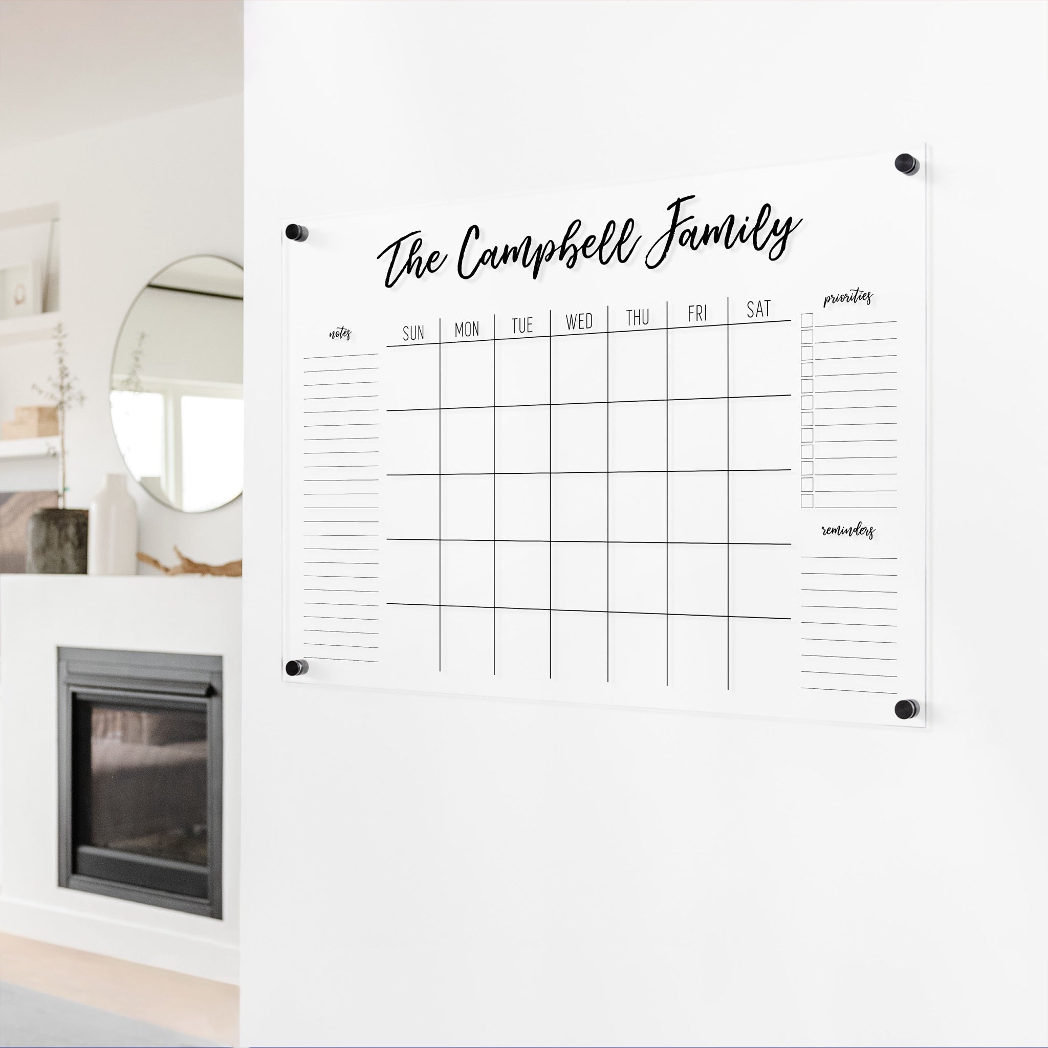 A Dry-erase monthly calender made of acrylic hanging on the wall