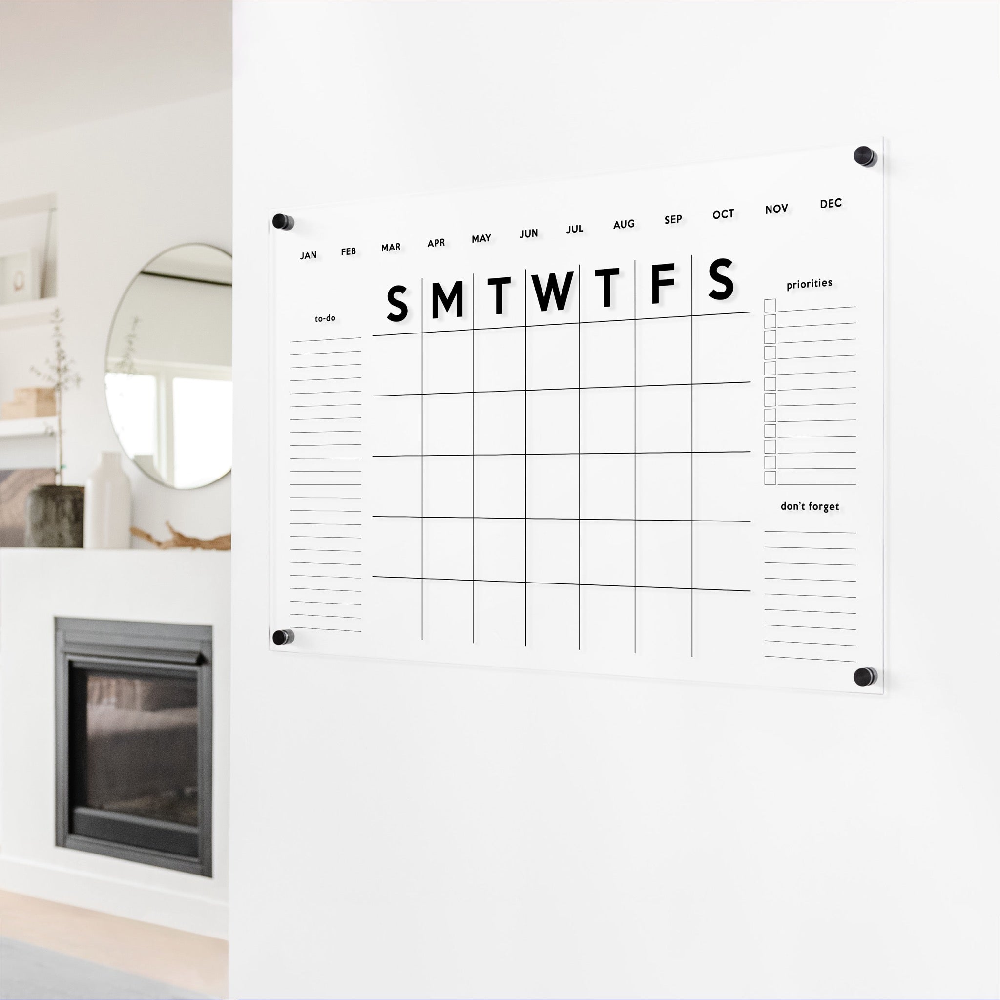 A Dry-erase monthly calender made of acrylic hanging on the wall