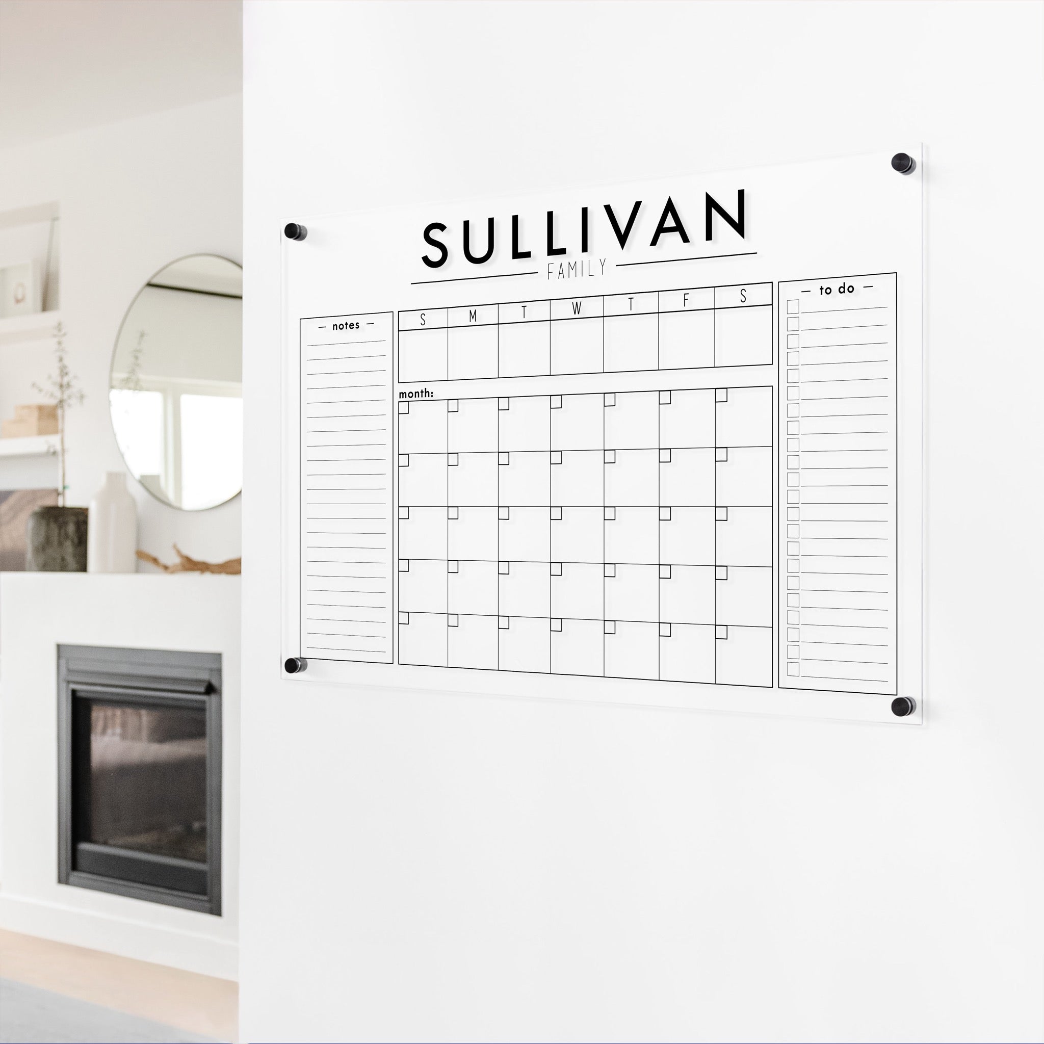 A Dry-erase calendar with a monthly and weekly format made of acrylic hanging on the wall