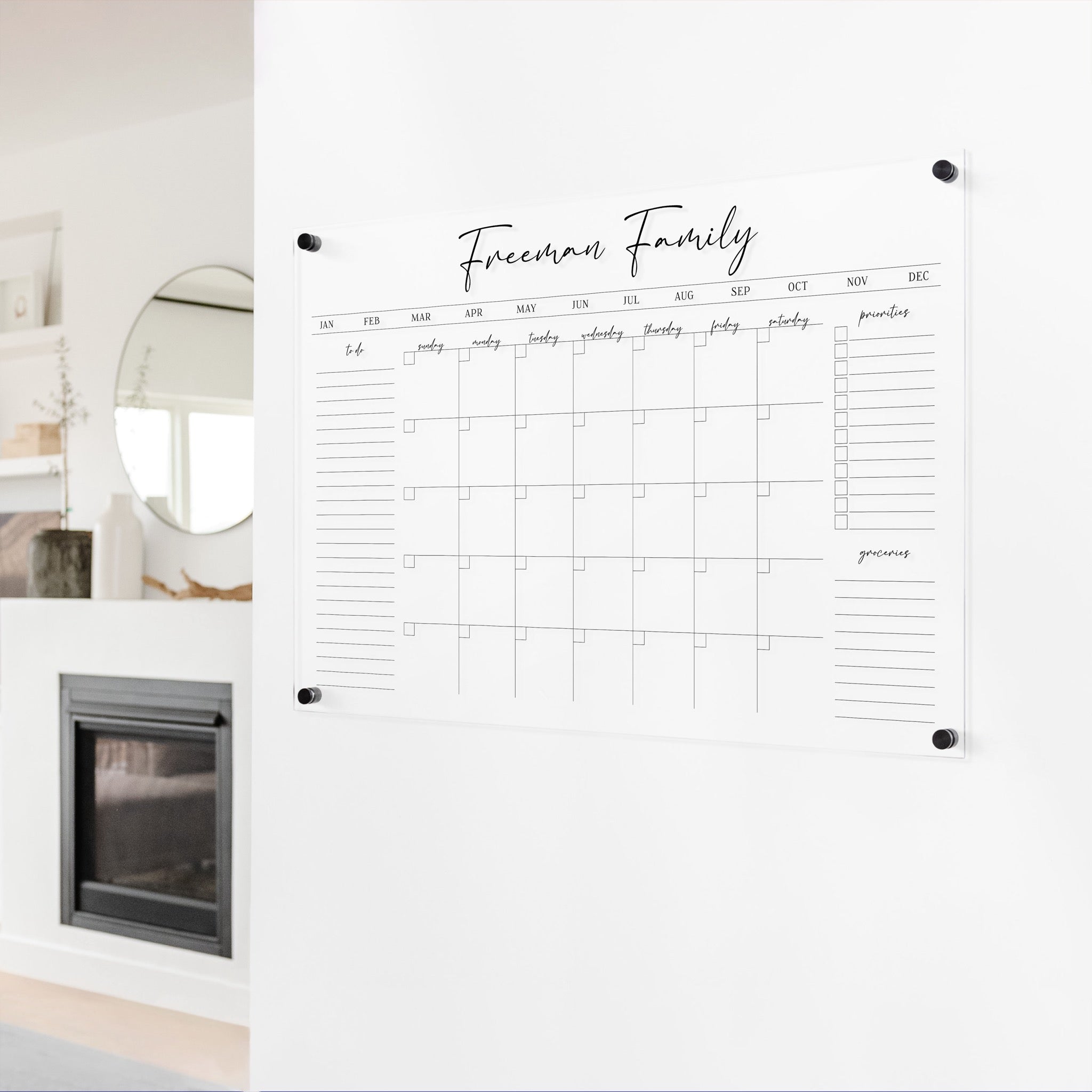 A Dry-erase monthly calender made of acrylic hanging on the wall