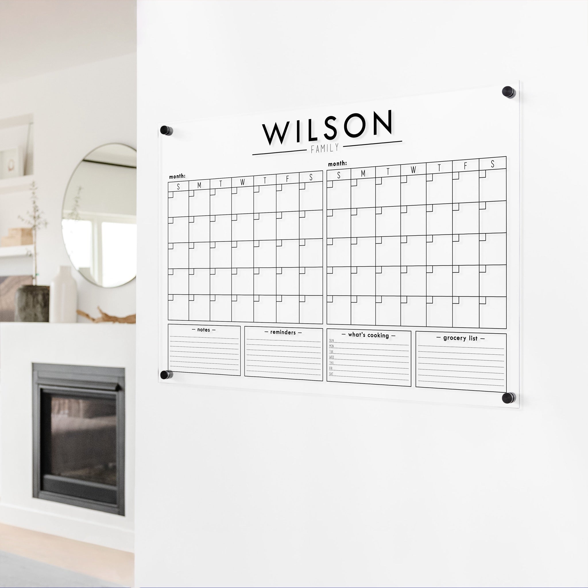 A Dry-erase acrylic calendar with a two month design format hanging on the wall