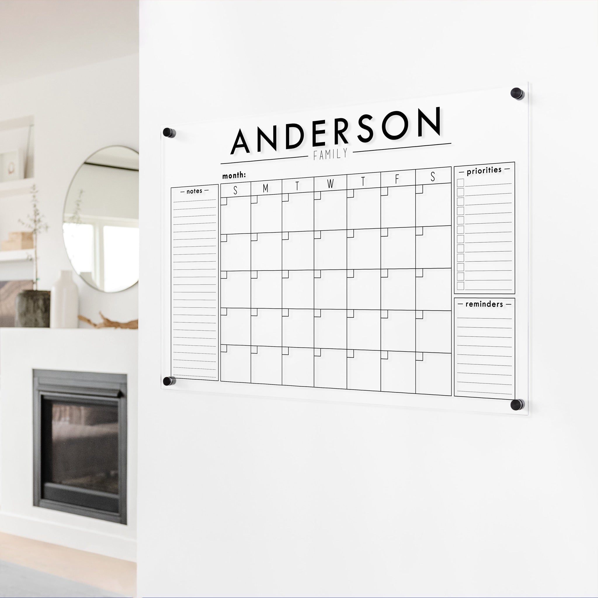 A Dry-erase monthly calender made of acrylic hanging on the wall
