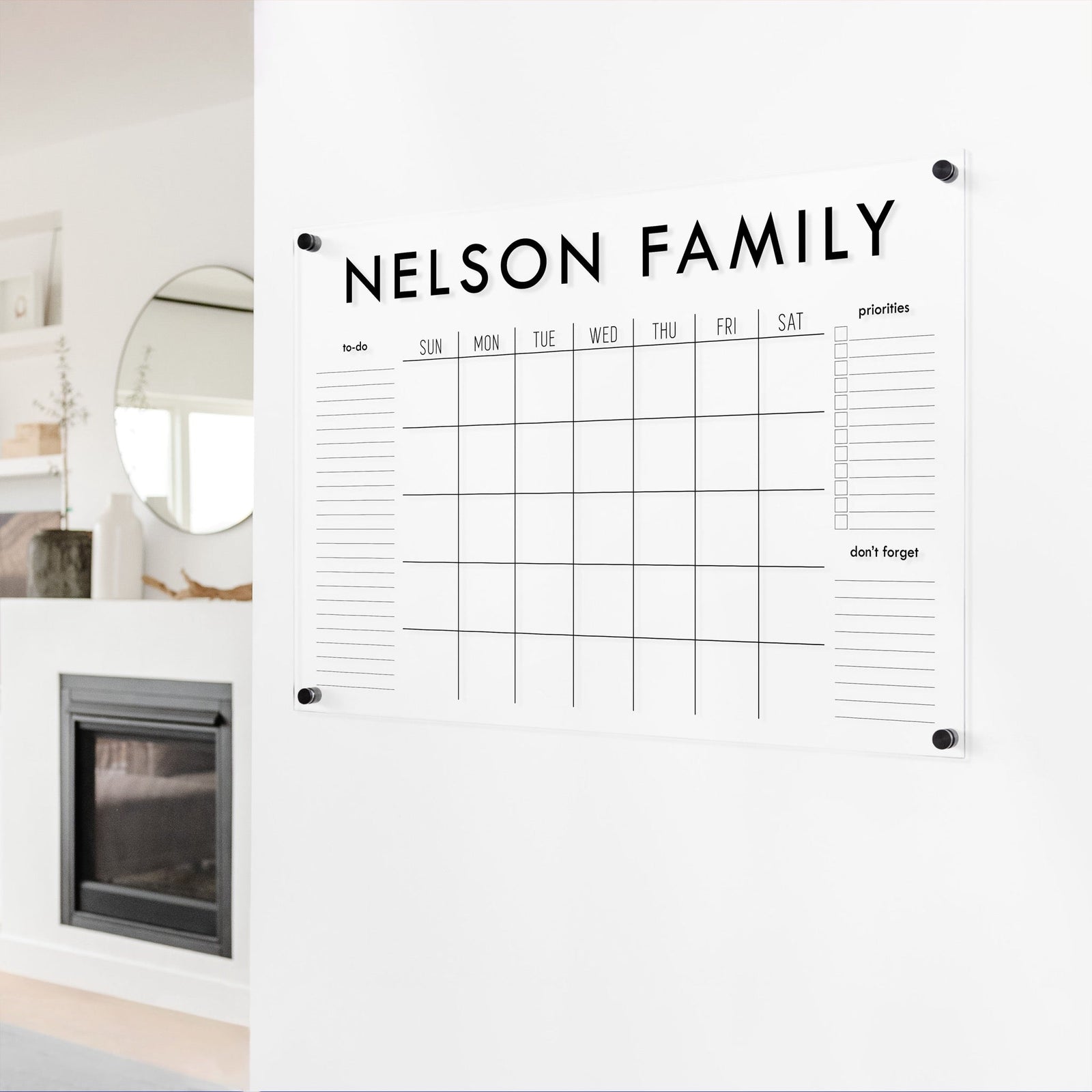 A Dry-erase monthly calender made of acrylic hanging on the wall