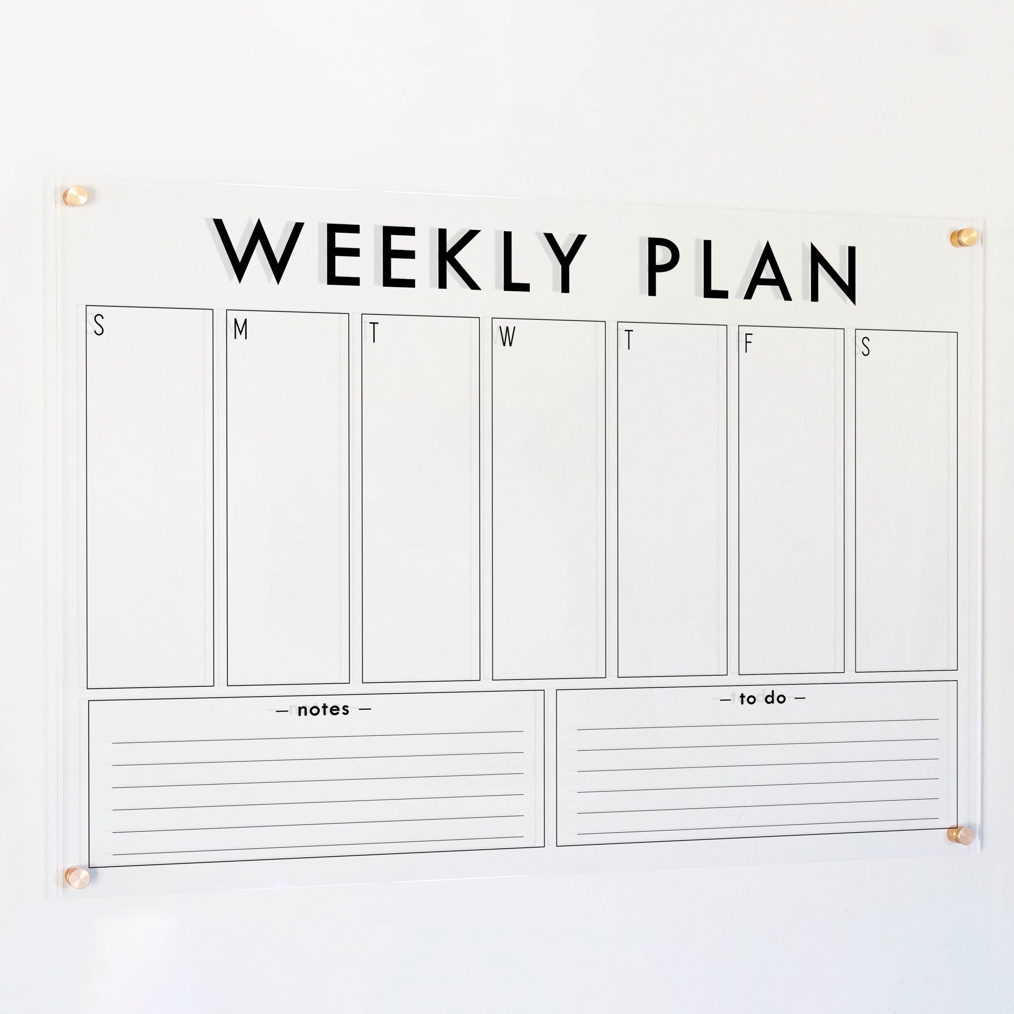 A Dry-erase weekly calender made of acrylic hanging on the wall