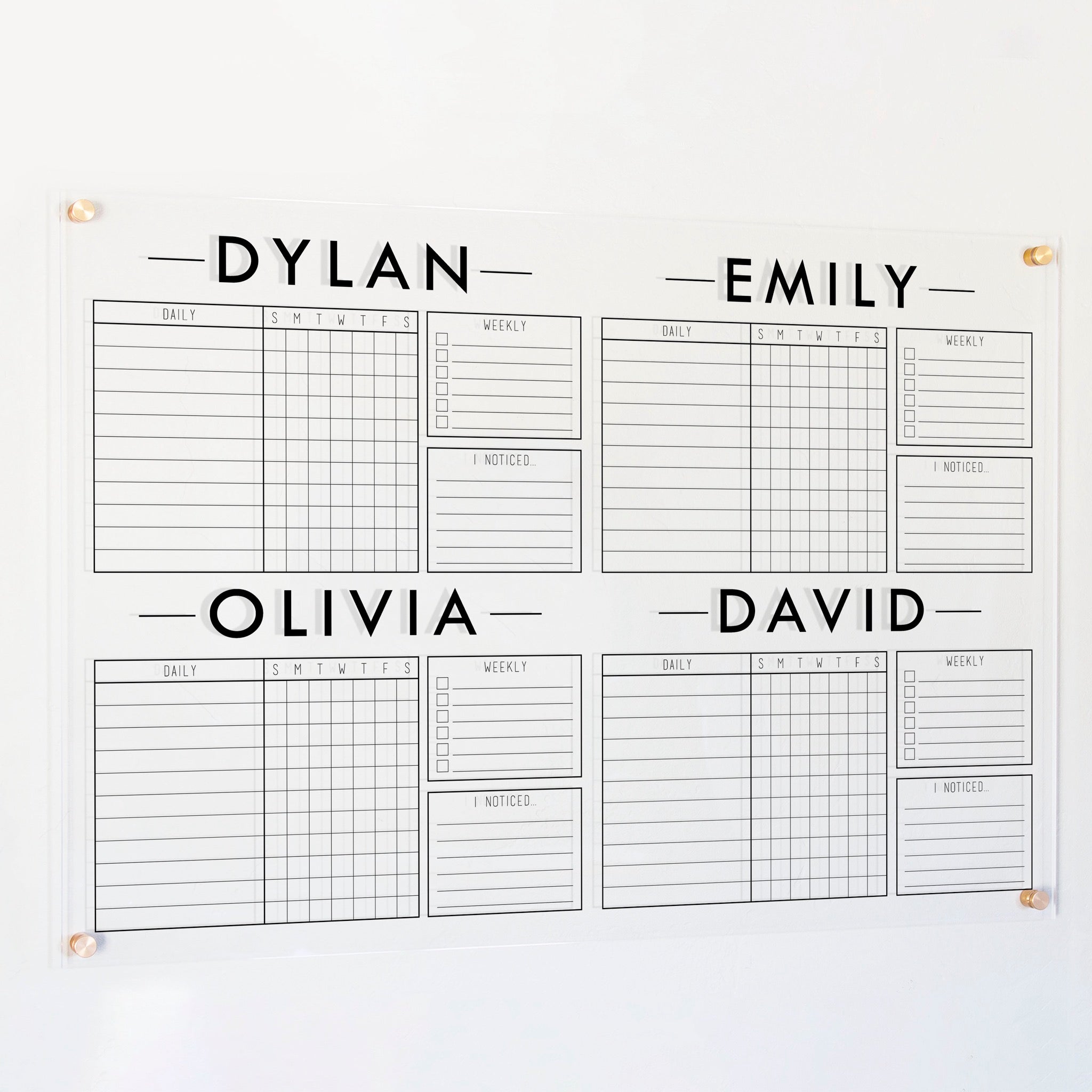 A Dry-erase acrylic chore chart hanging on the wall