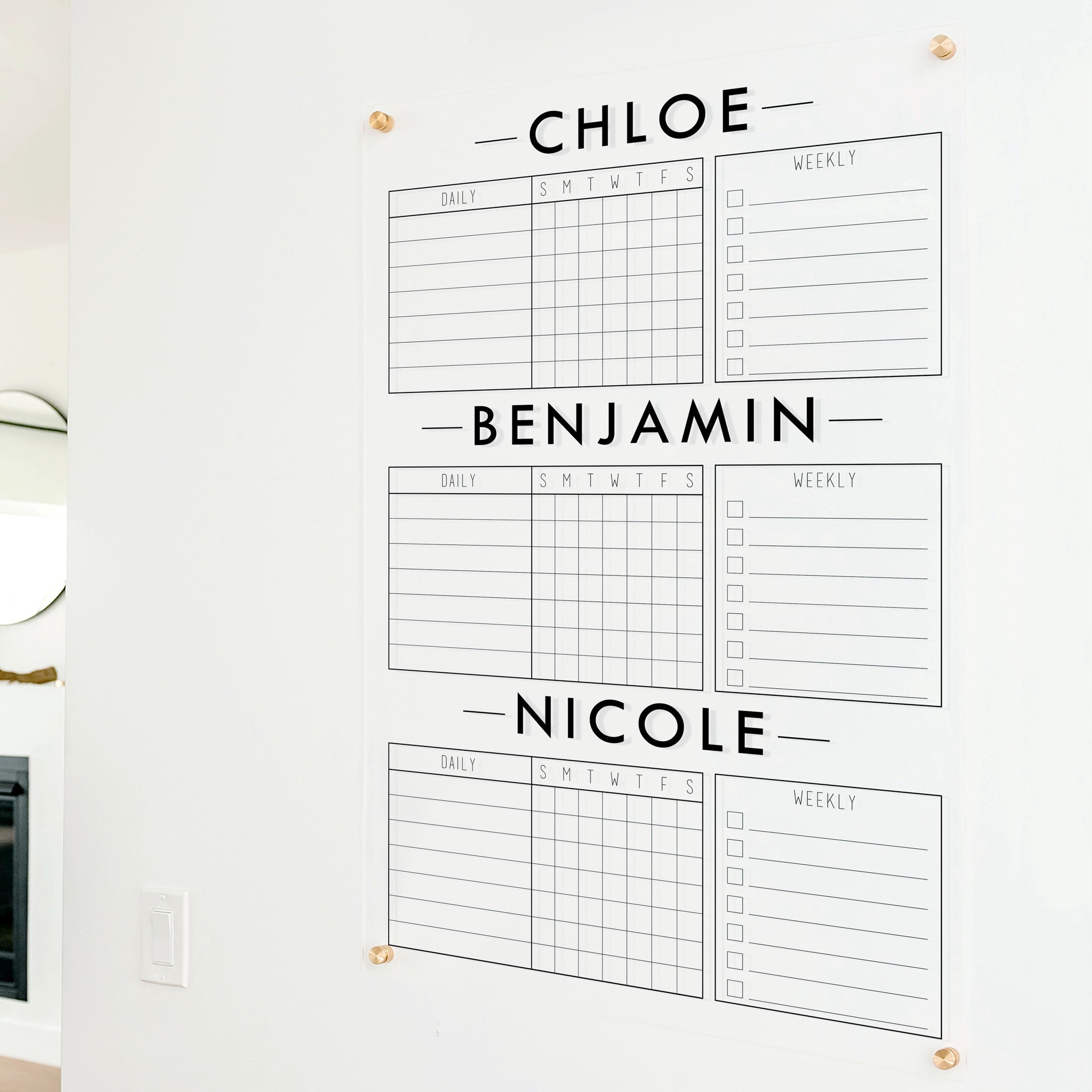 A Dry-erase acrylic chore chart hanging on the wall