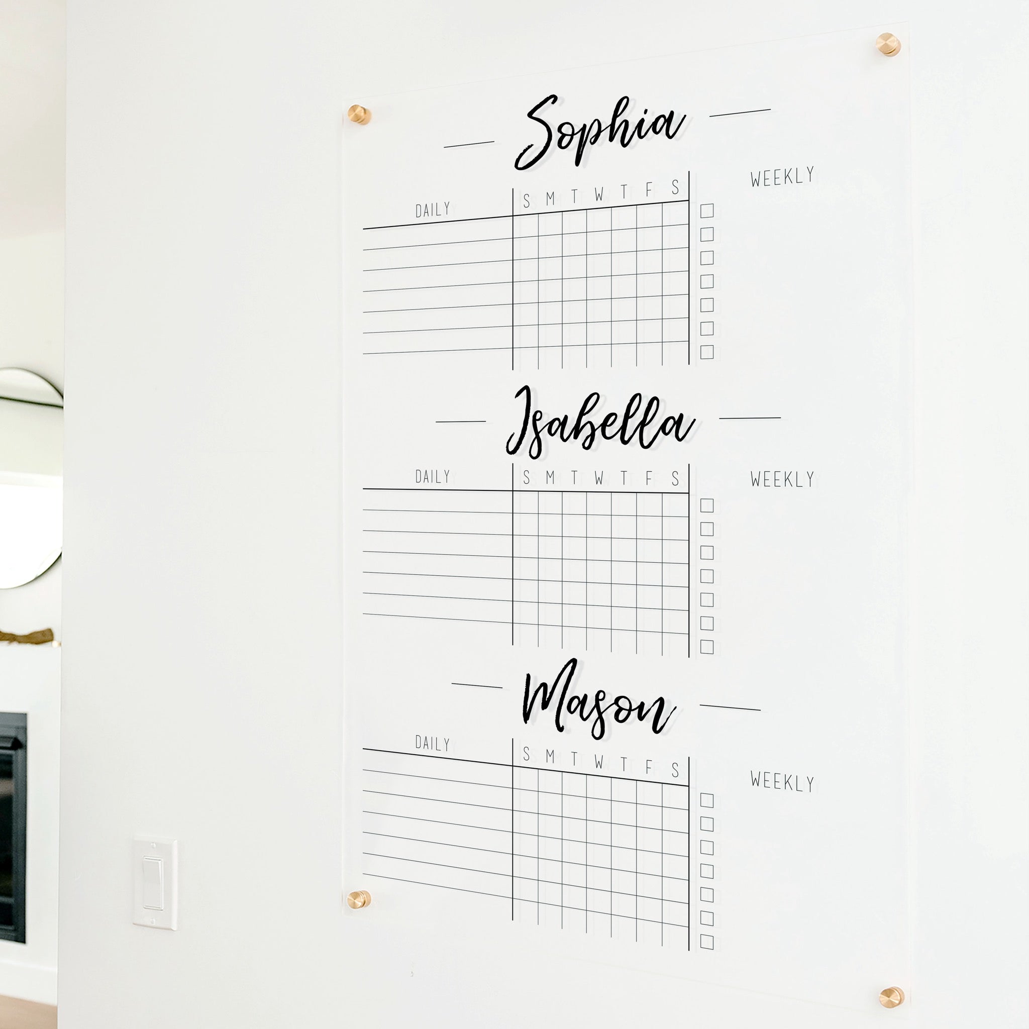 A Dry-erase acrylic chore chart hanging on the wall