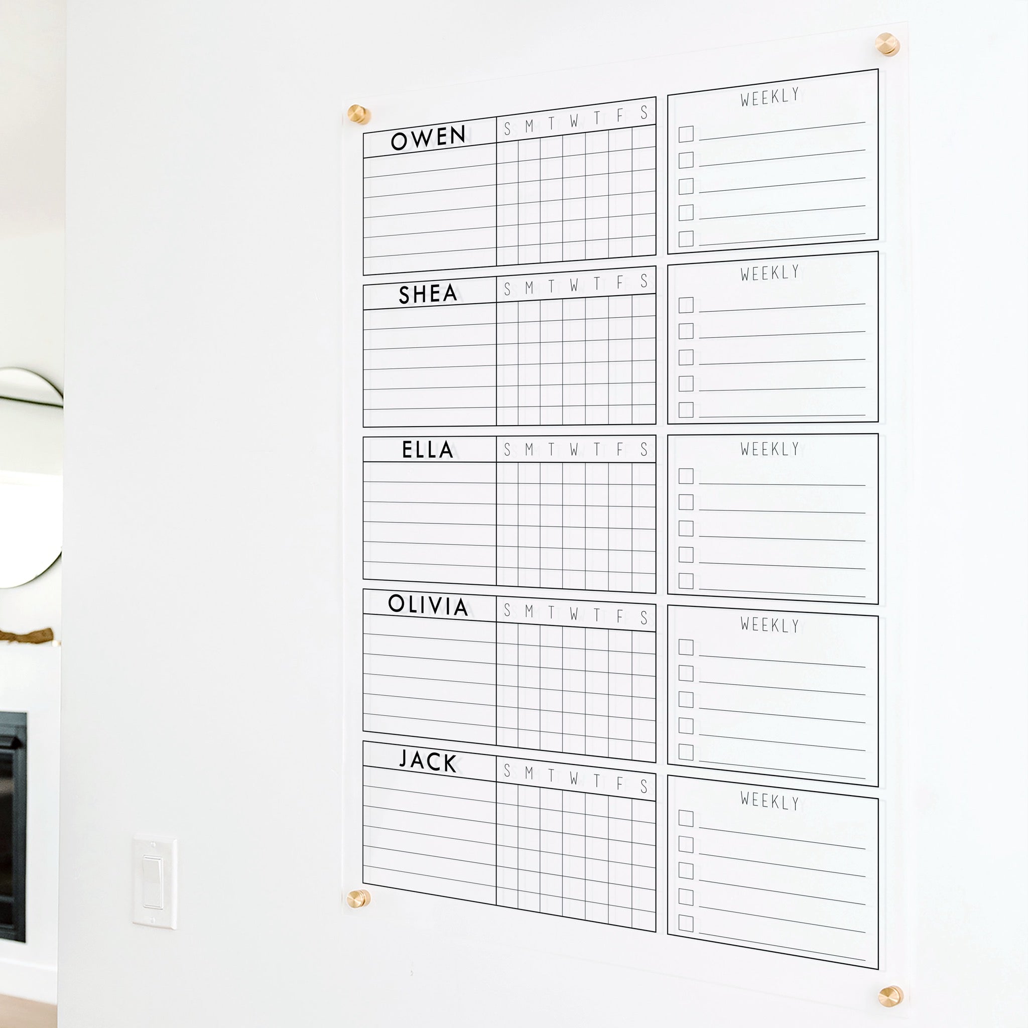A Dry-erase acrylic chore chart hanging on the wall