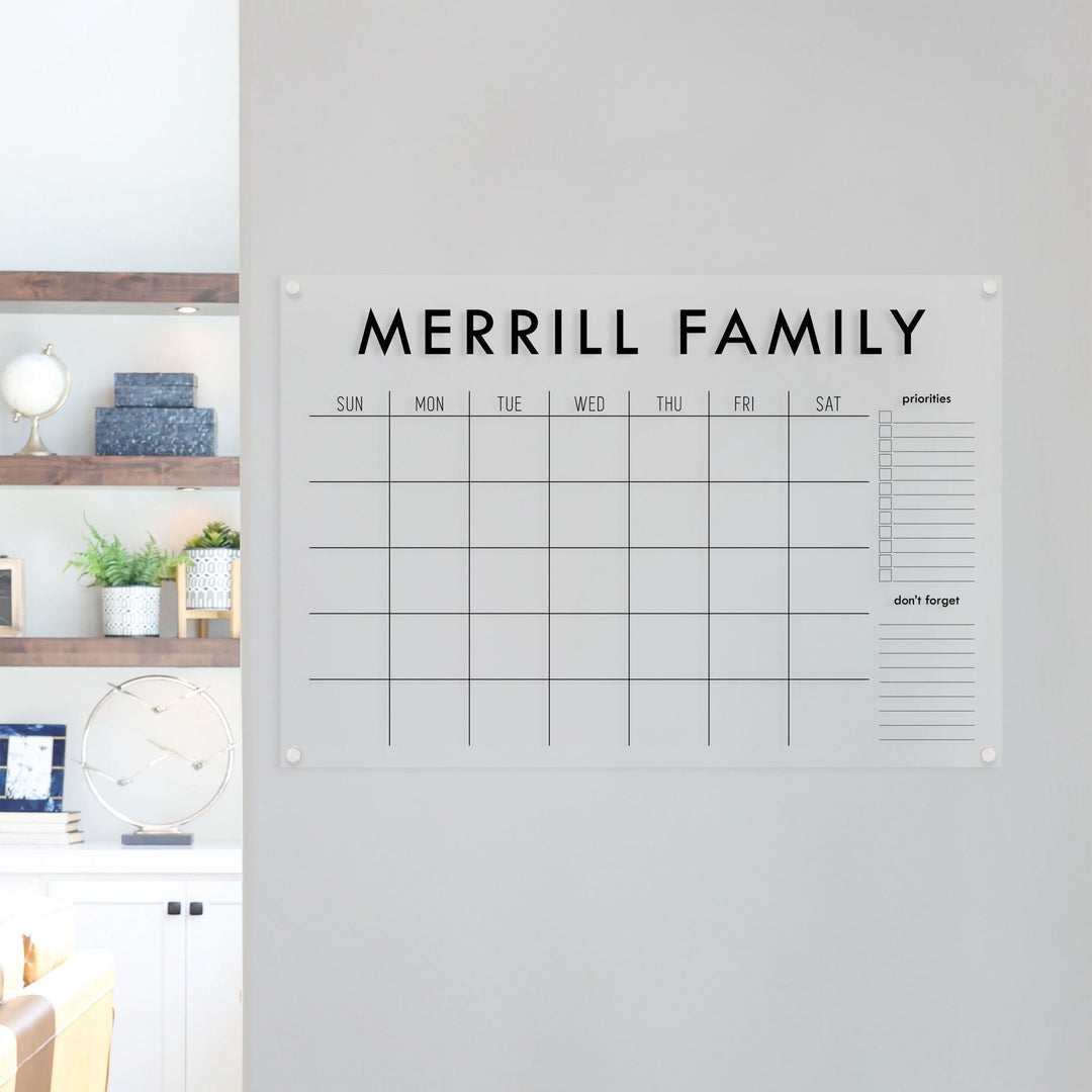 A Dry-erase monthly calender made of acrylic hanging on the wall