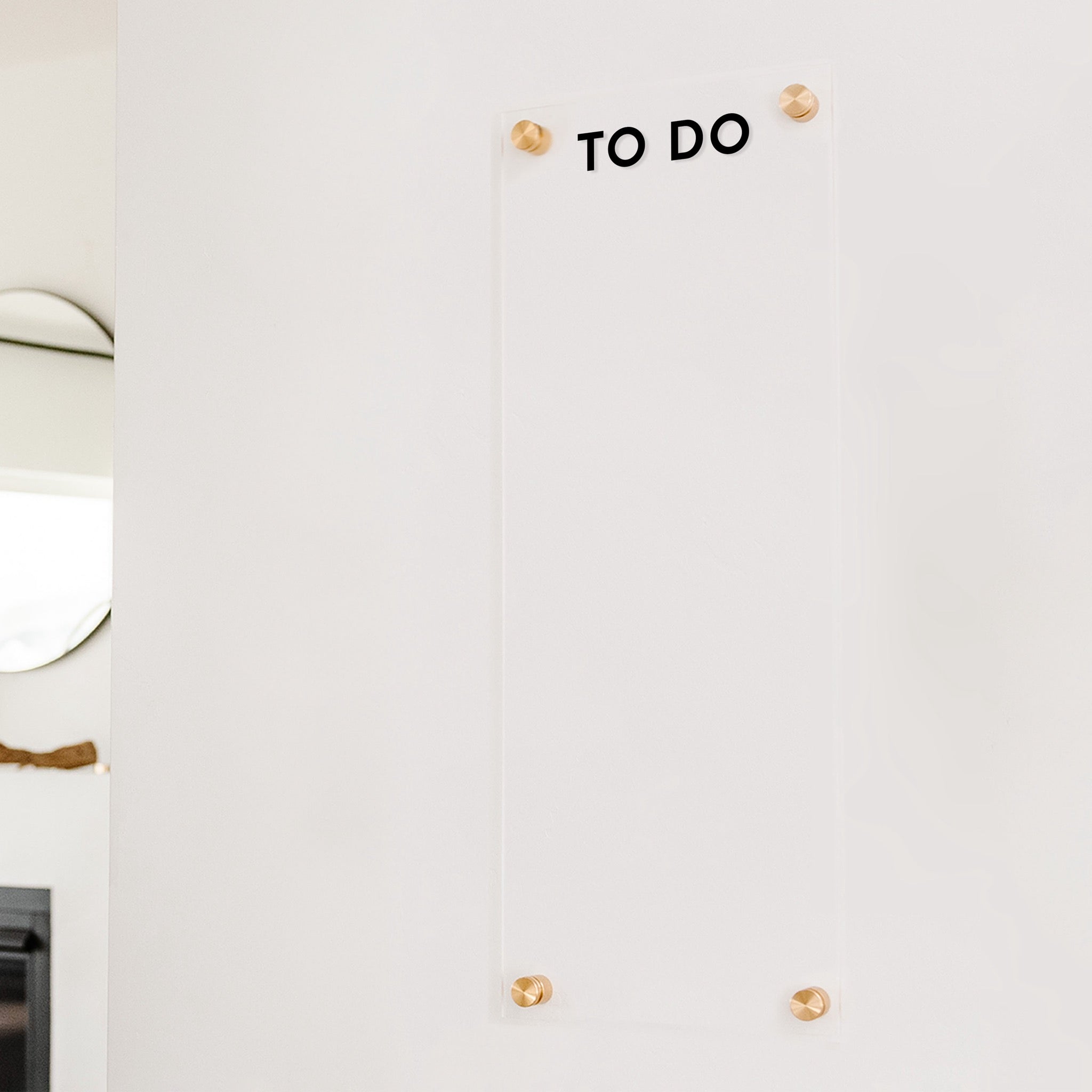 A dry-erase board made of clear acrylic with a custom title up top