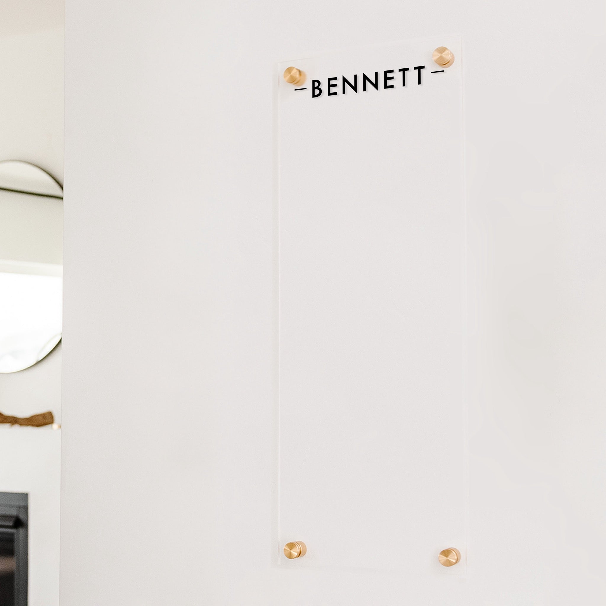 A dry-erase board made of clear acrylic with a custom title up top