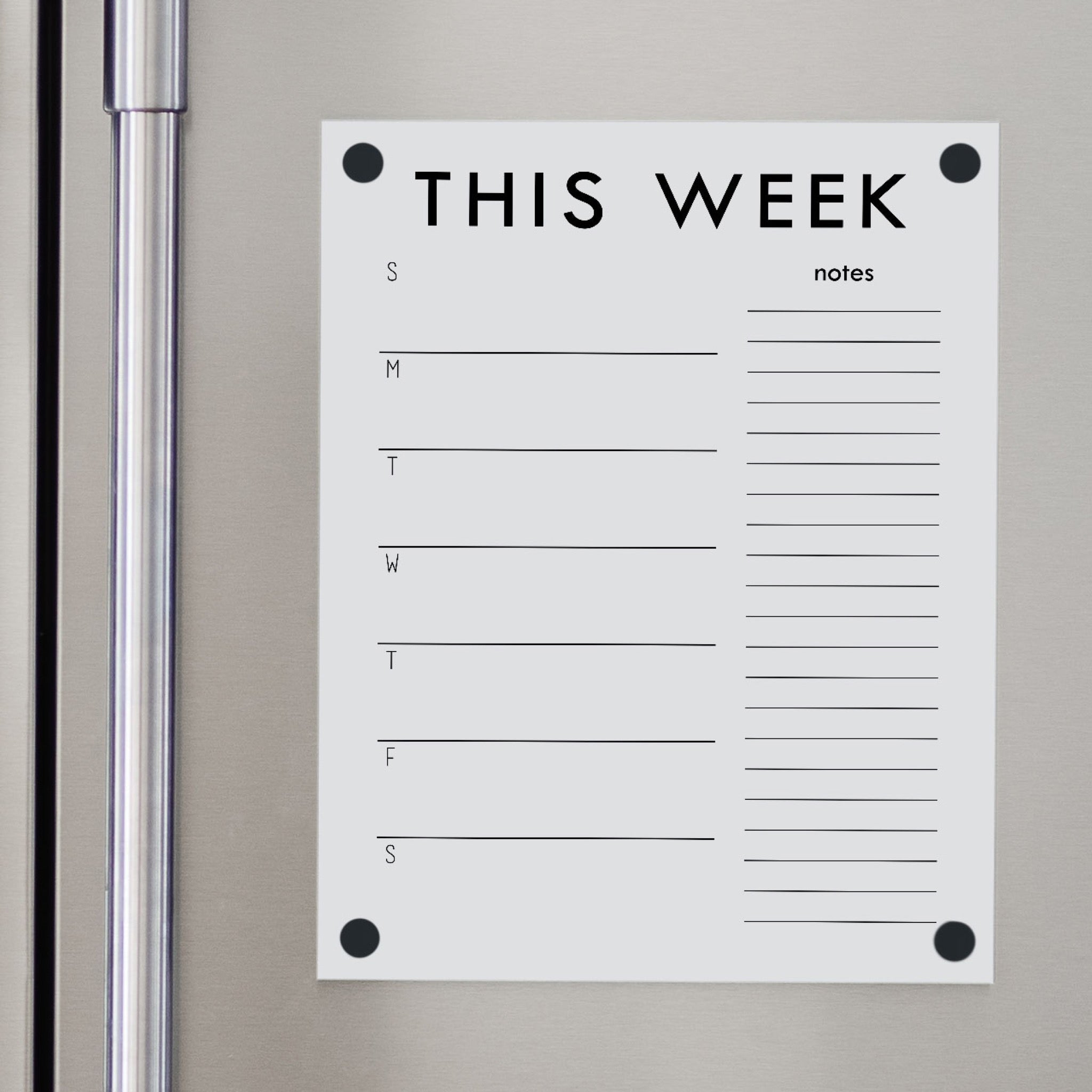 A Dry-erase weekly calender made of magnetic acrylic hanging on the fridge