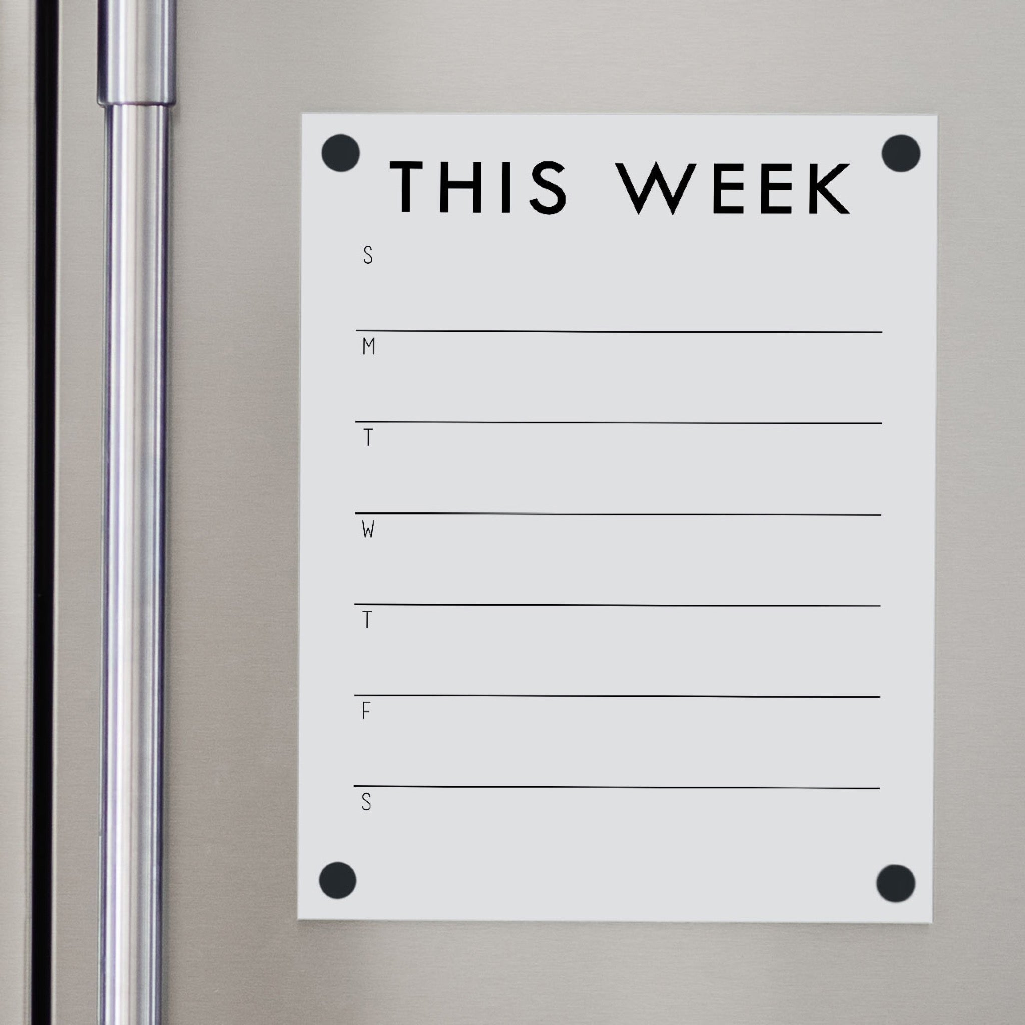 A Dry-erase weekly calender made of magnetic acrylic hanging on the fridge