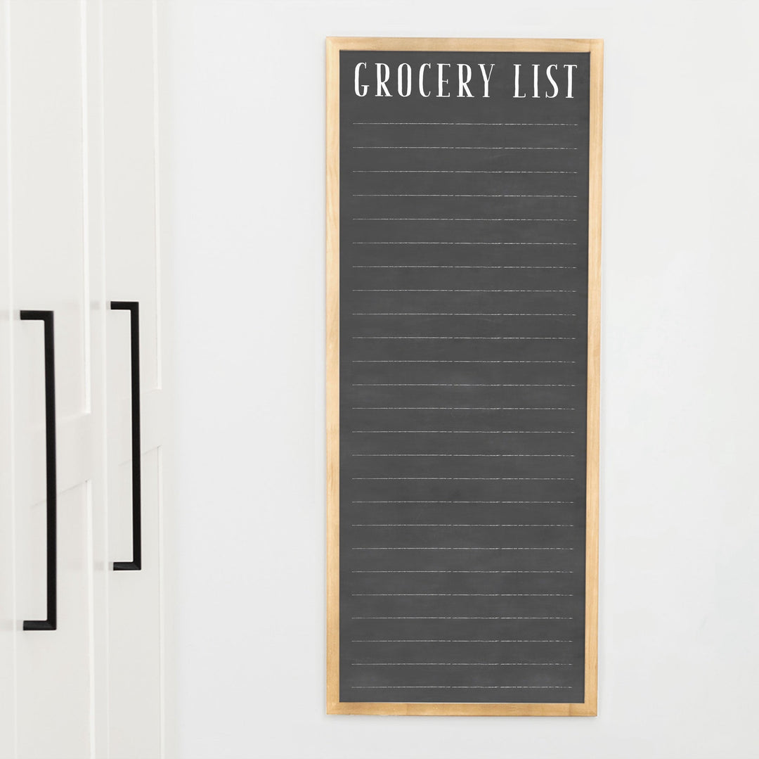 A framed dry-erase to do list with a chalkboard look hanging on the wall