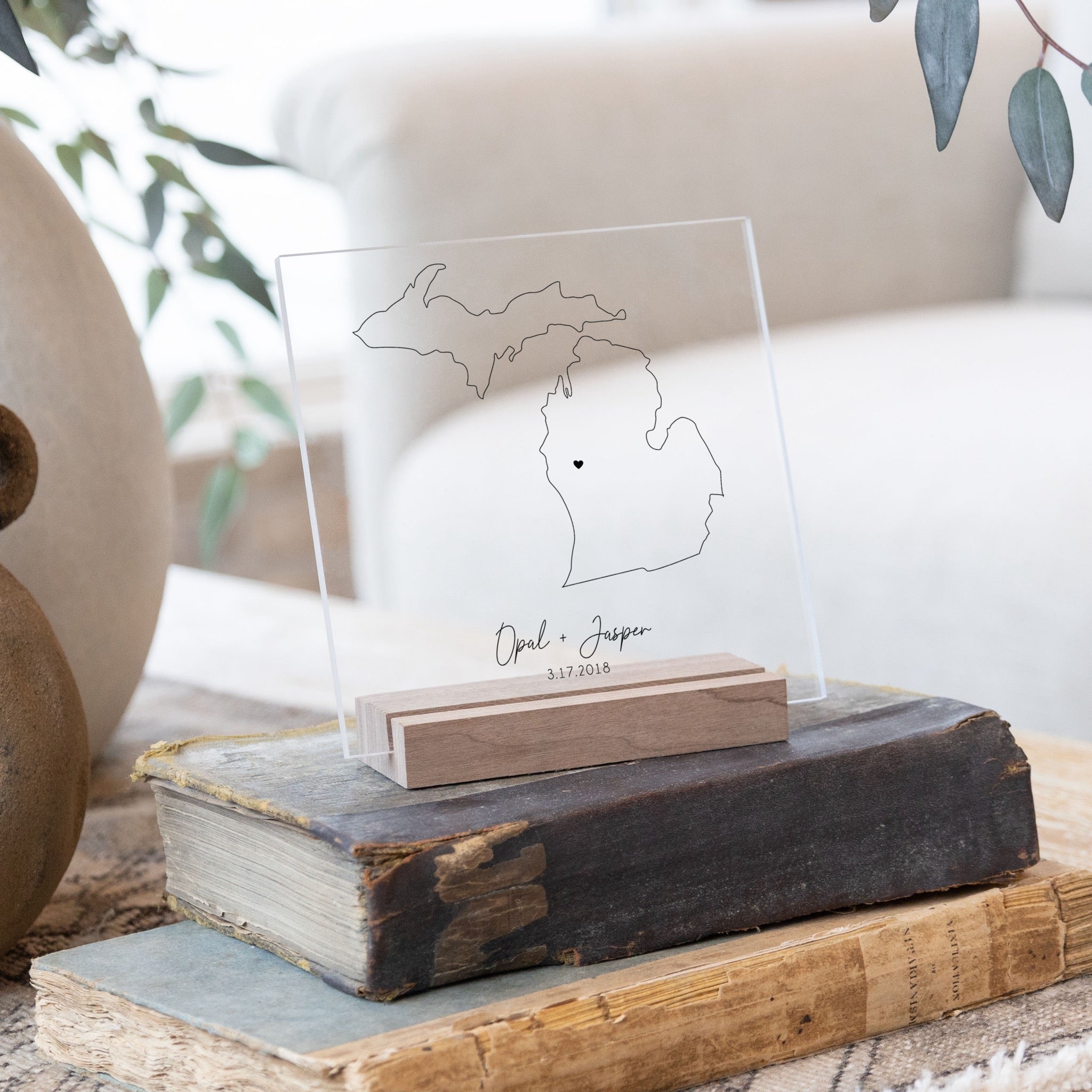 Clear acrylic sign with wood base featuring a Michigan location and custom text