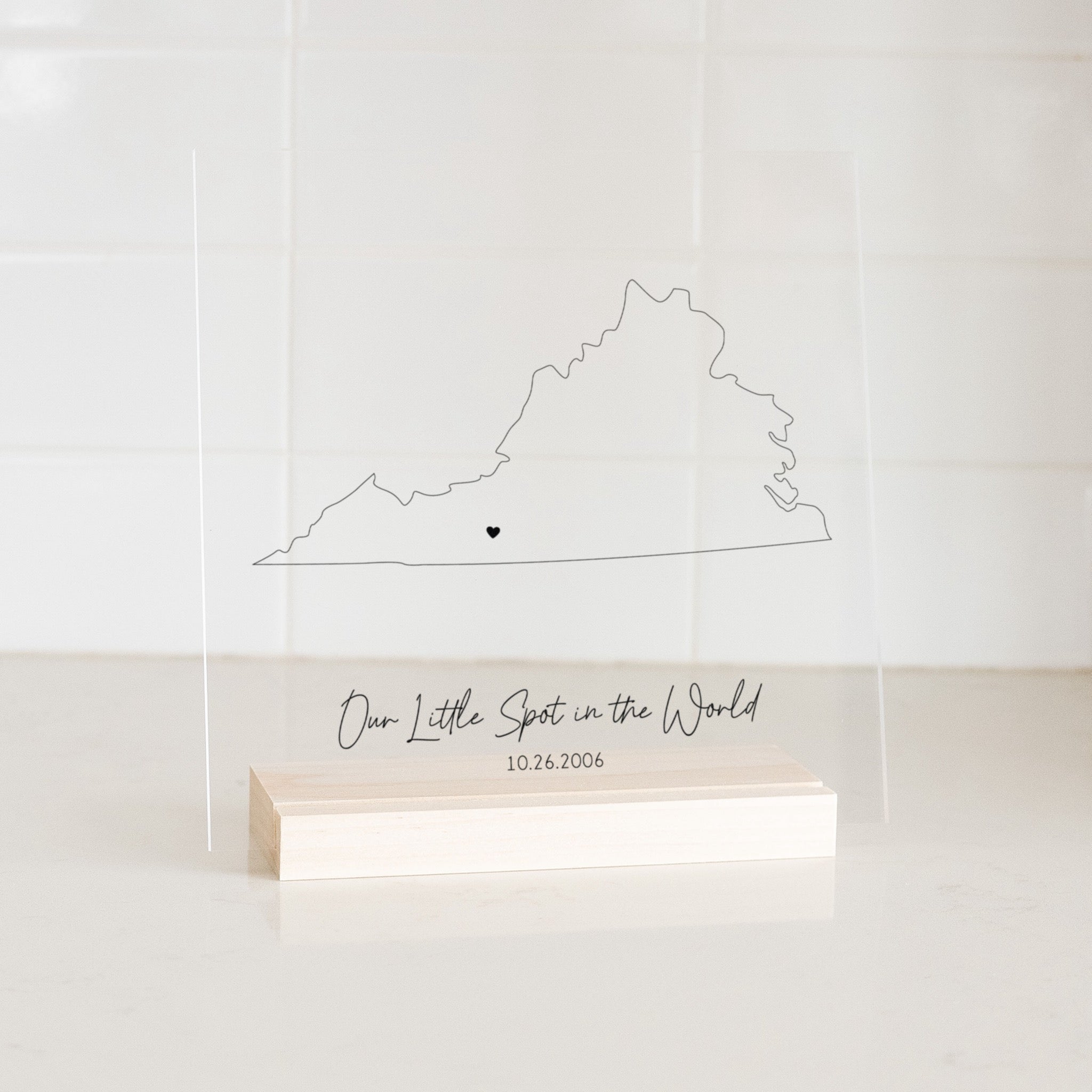 Clear acrylic sign with wood base featuring a Virginia location and custom text