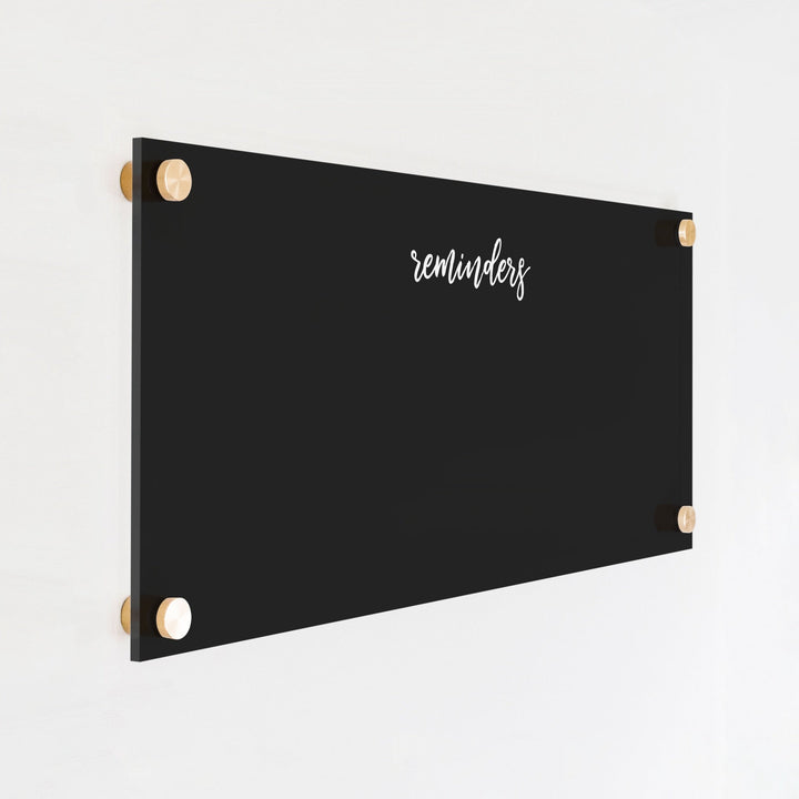 A dry-erase board made of clear acrylic with a custom title up top