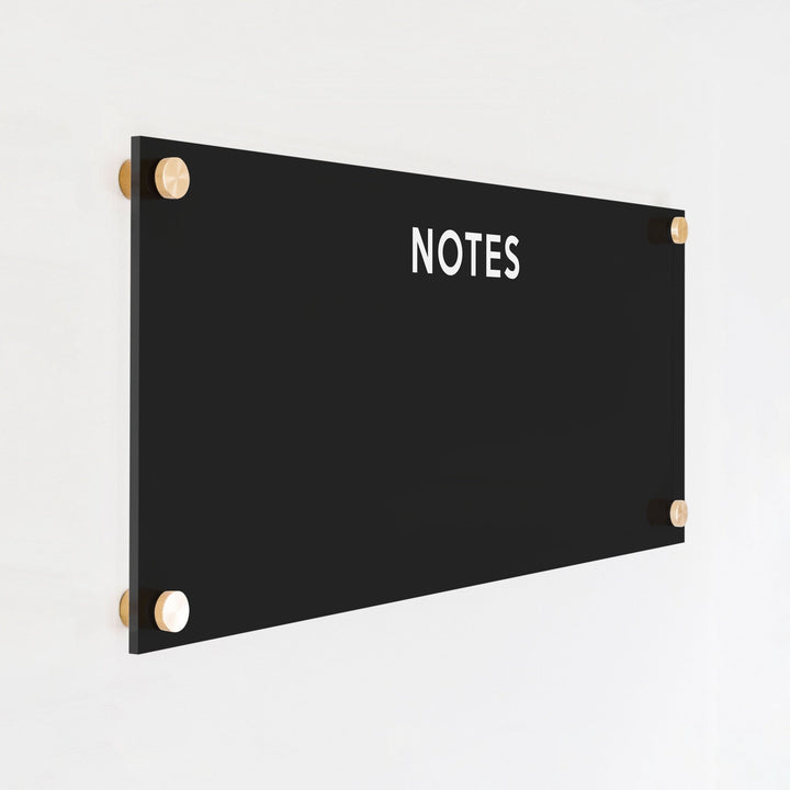 A dry-erase board made of clear acrylic with a custom title up top