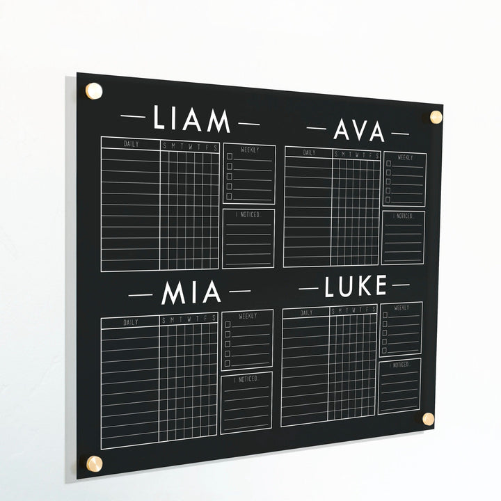 A Dry-erase acrylic chore chart hanging on the wall