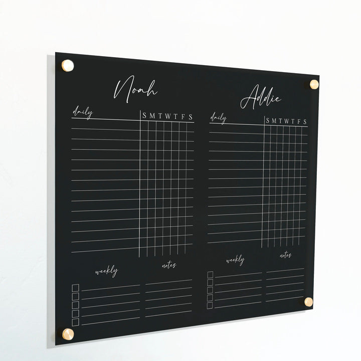 A Dry-erase acrylic chore chart hanging on the wall