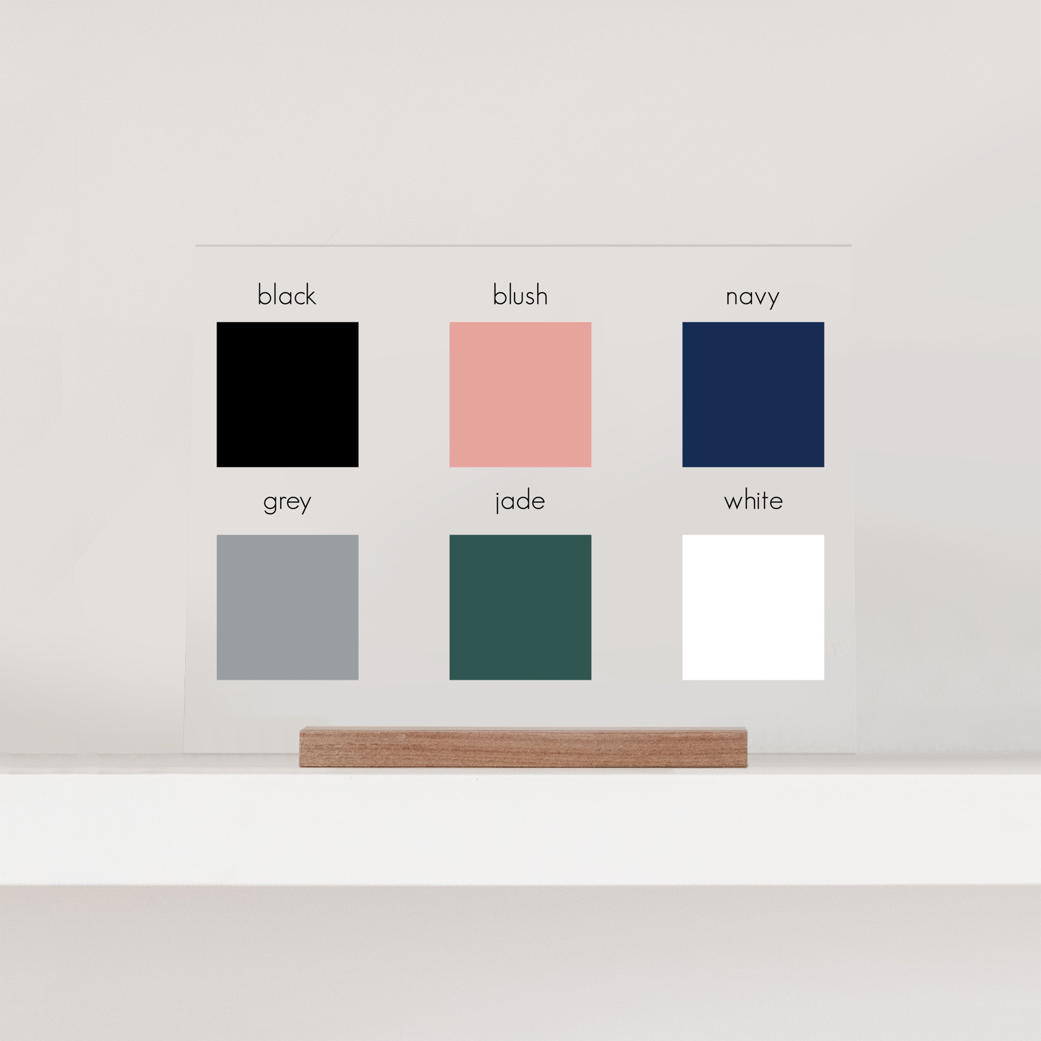 A visual display of the six color choices, including black, blush, navy, grey, jade, and white.