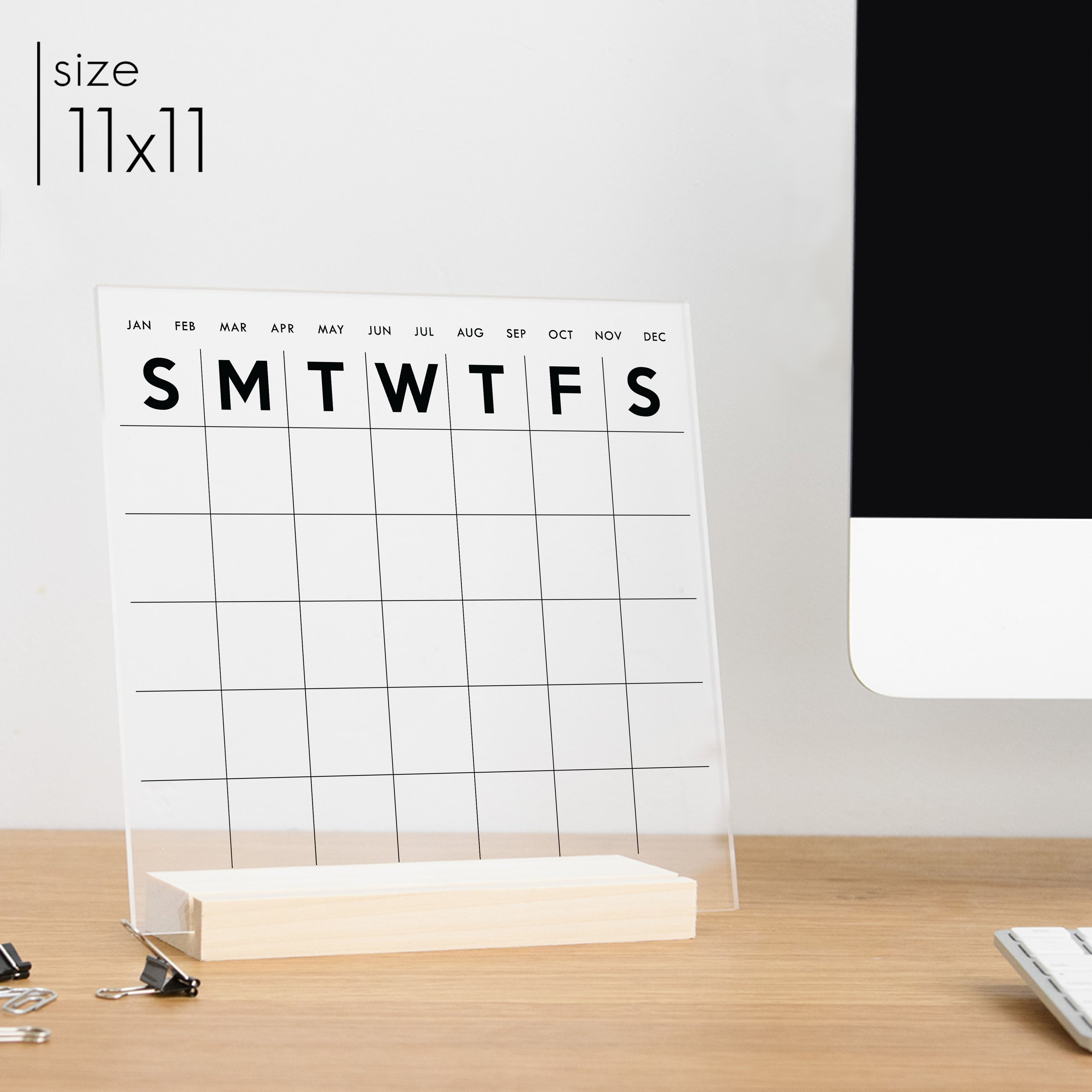 An 11x11 minimalist calendar on printed clear acrylic.