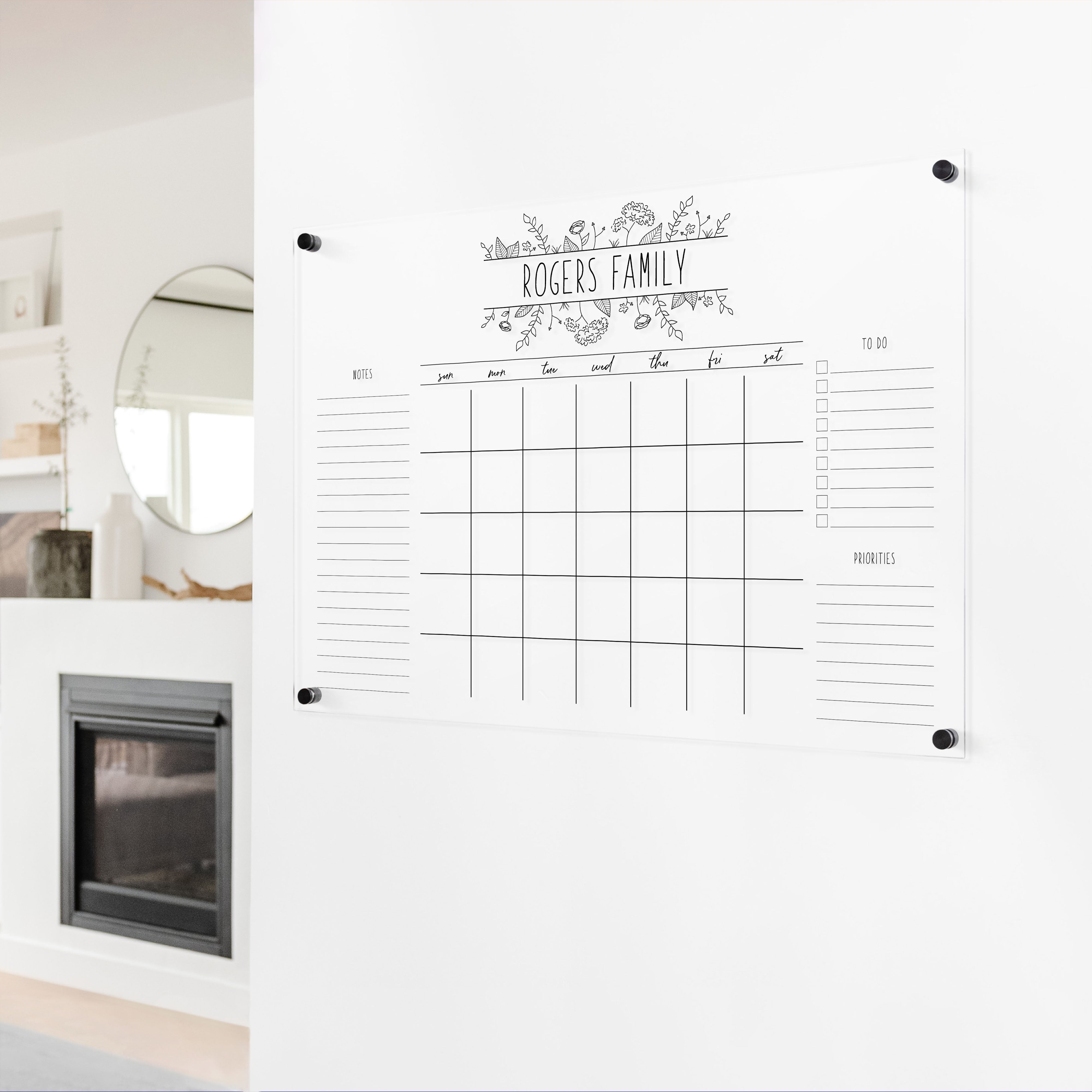 A Dry-erase monthly calender made of acrylic hanging on the wall