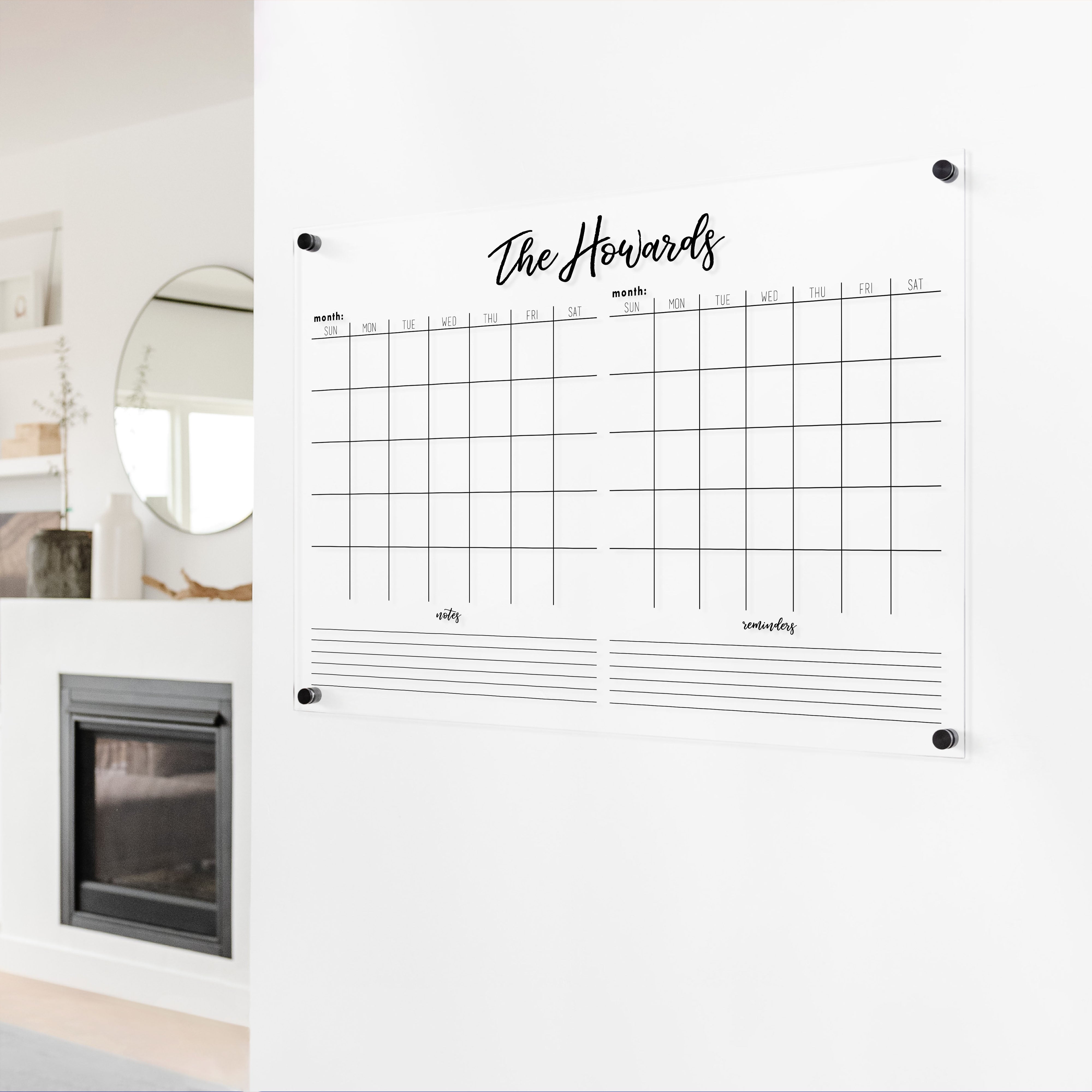 A Dry-erase acrylic calendar with a two month design format hanging on the wall