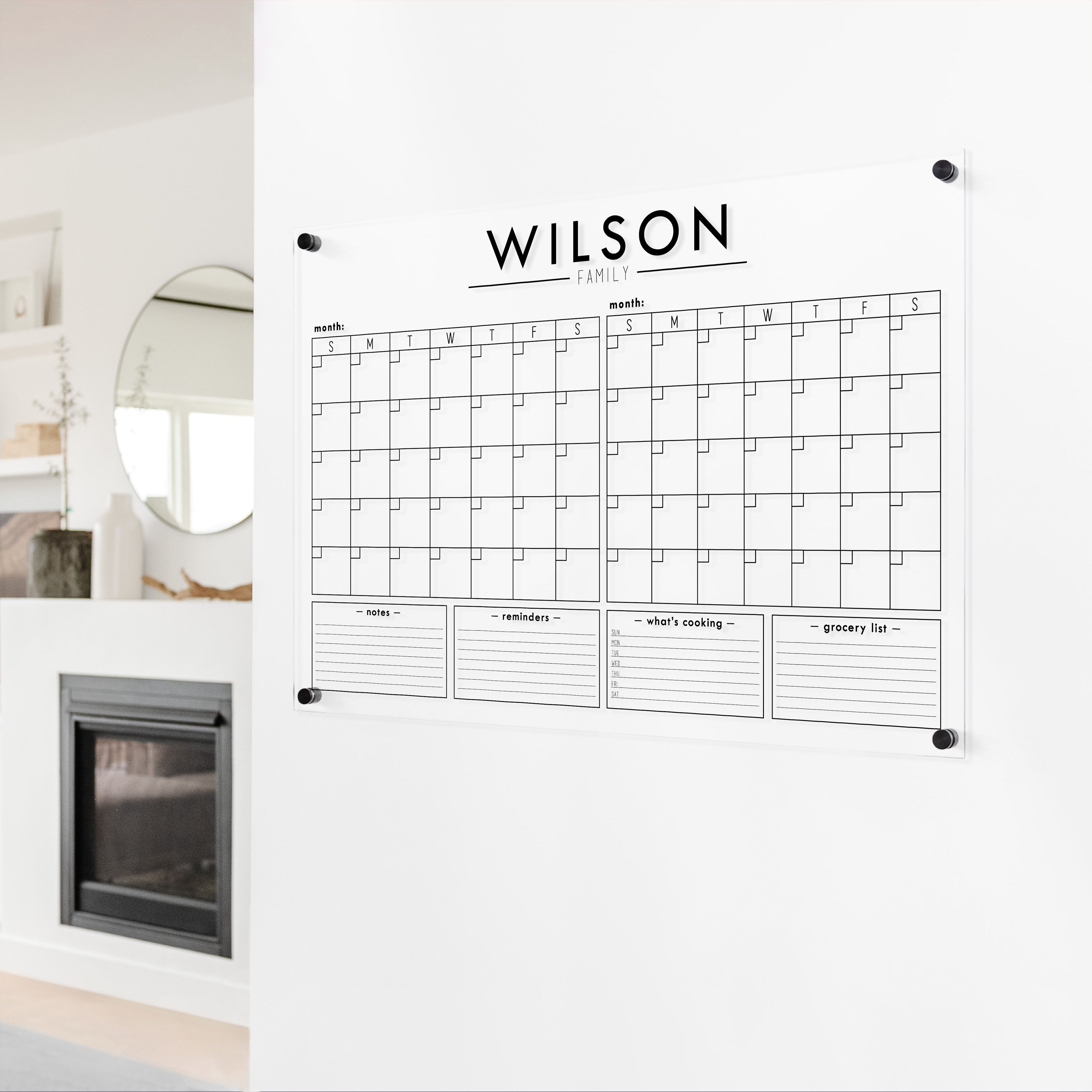 A Dry-erase acrylic calendar with a two month design format hanging on the wall
